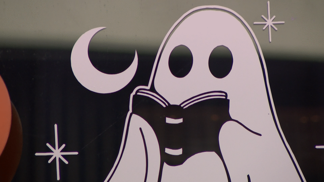 A cartoon ghost reading a book is pictured at Nocturnal Nook Novelties in Lehi on Tuesday.