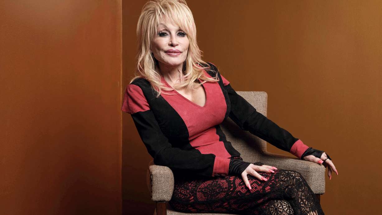 Dolly Parton poses at the Carnegie Medal of Philanthropy Ceremony in New York, on Oct. 13, 2022. Dolly Parton's nephew and longtime head of security said in a Tennessee court filing that he was a close friend and ally of Parton's longtime manager Danny Nozell before Nozell took out a restraining order accusing him of threatening to do violence and destroy Parton's legacy and business empire.