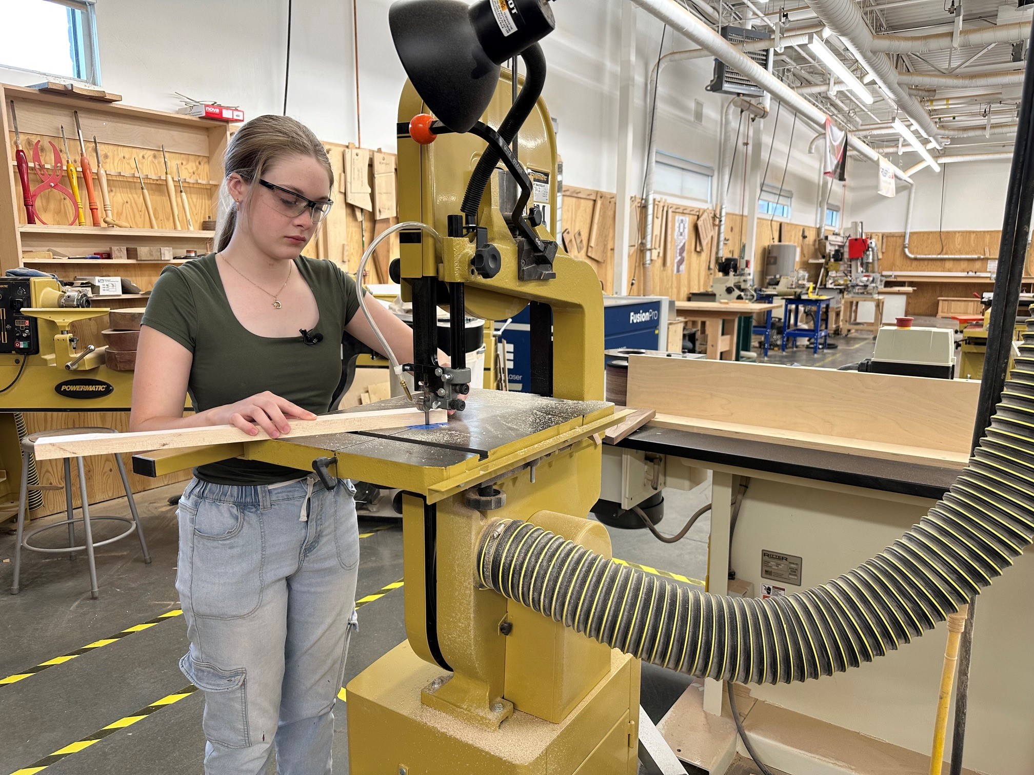 Shop student Morgan Burke works on part of the chair.