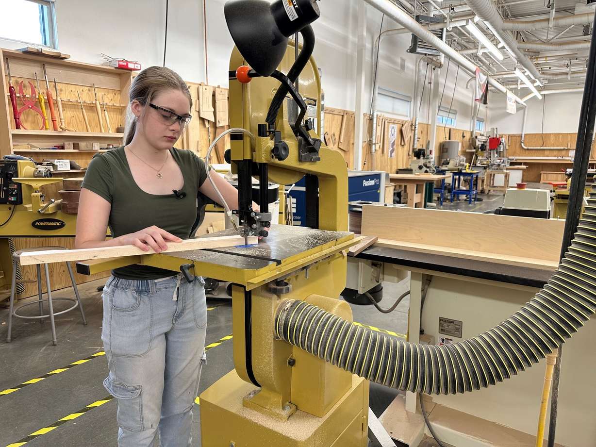 Shop student Morgan Burke works on part of the chair.
