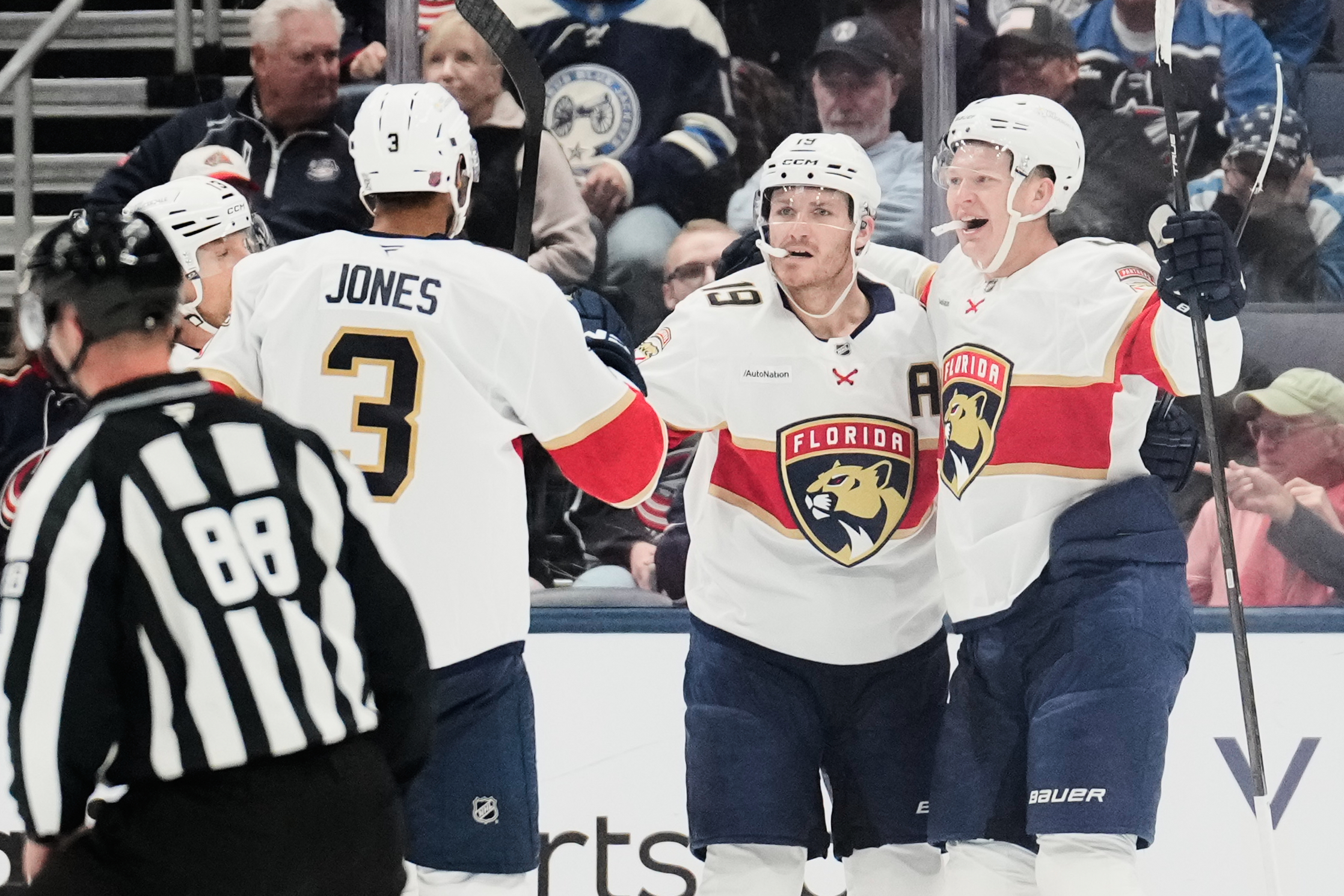 Florida Panthers left wing Brady Tkachuk, right, celebrates his goal against the Columbus Blue Jackets with Seth Jones (3) and Matthew Tkachuk (19) in the second period of an NHL hockey game in Columbus, Ohio, Tuesday, Oct. 13, 2026. 