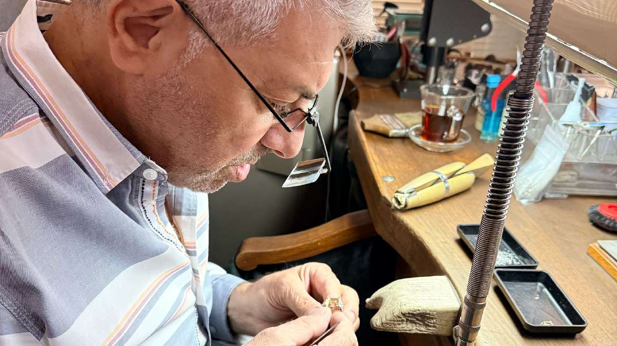 Hrant Zorbas, 66, a “mihlama,” or stone-setting master, checks a gold ring setting before placing a ruby at its center.