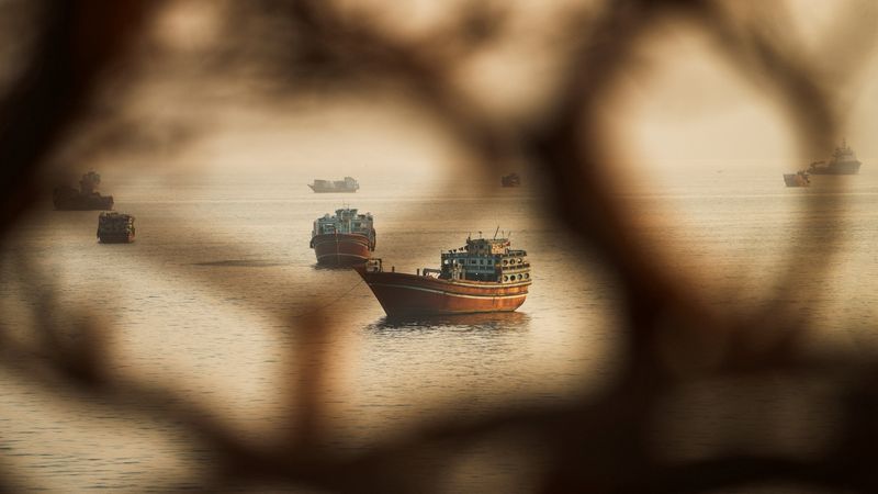 Two Singapore-registered vessels struck in Strait of Hormuz; one sinks