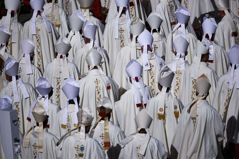Clergy attend a Mass led by Cardinal Luis Antonio Tagle marking the 10th anniversary of the apostolic exhortation Amoris Laetitia, including special prayers for the health of Pope Leo XIV, who is in hospital after lung surgery, in St. Peter's Square at the Vatican, Wednesday.