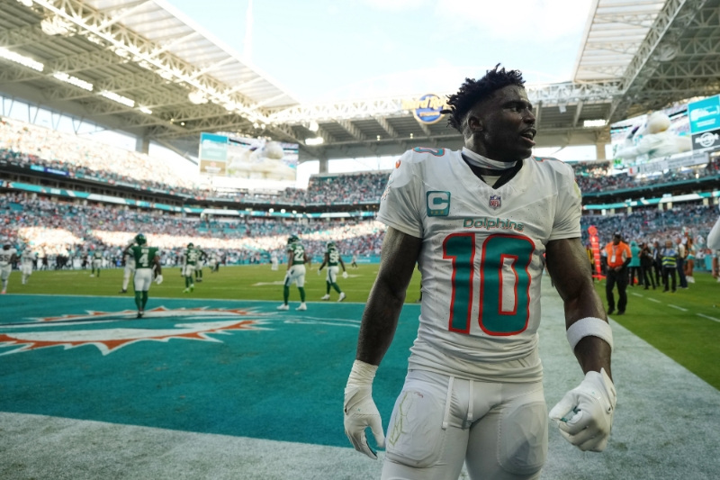 Dec 8, 2024; Miami Gardens, Florida, USA; Miami Dolphins wide receiver Tyreek Hill (10) celebrates after defeating the New York Jets during overtime at Hard Rock Stadium.