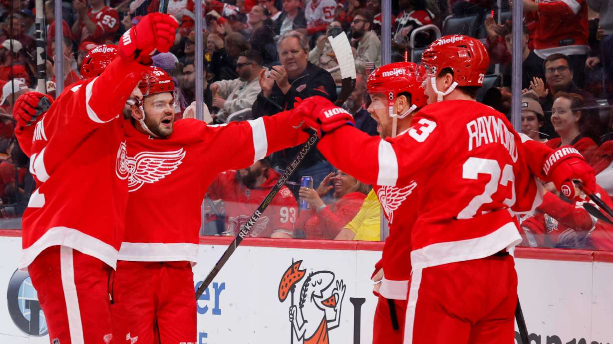 Detroit Red Wings left wing Viktor Arvidsson, second from right, celebrates with, from left, center Dylan Larkin, right wing Alex DeBrincat and left wing Lucas Raymond (23) during the second period of an NHL hockey game Tuesday, Oct. 6, 2026, in Detroit.