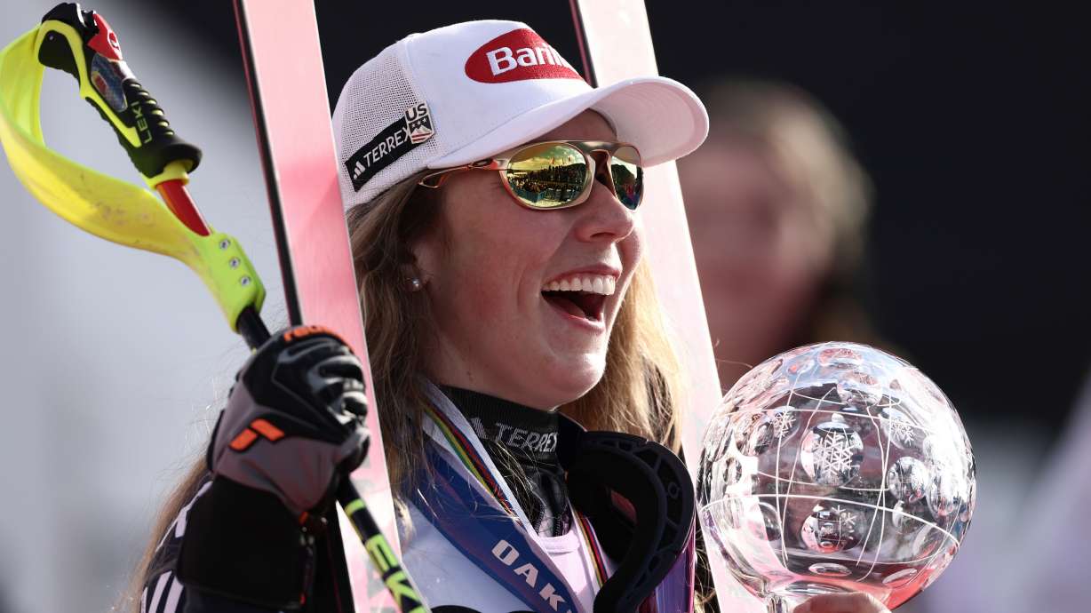 FILE - United States' Mikaela Shiffrin celebrates winning the globe trophy for the alpine ski women's slalom discipline at the Lillehammer World Cup Finals in Hafjell, Norway, March 24, 2026.