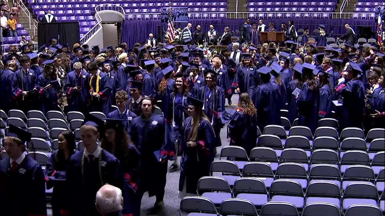 Graduates walk out of Woods Cross High School's annual commencement exercises at Weber State University's Dee Events Center on May 20. The school achieved a 100% graduation rate for English language learners.