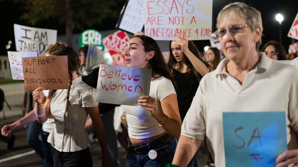 Demonstrators march from the Washington Monument to the White House during a "Stop Sexual Violence" protest in Washington, Oct. 8.