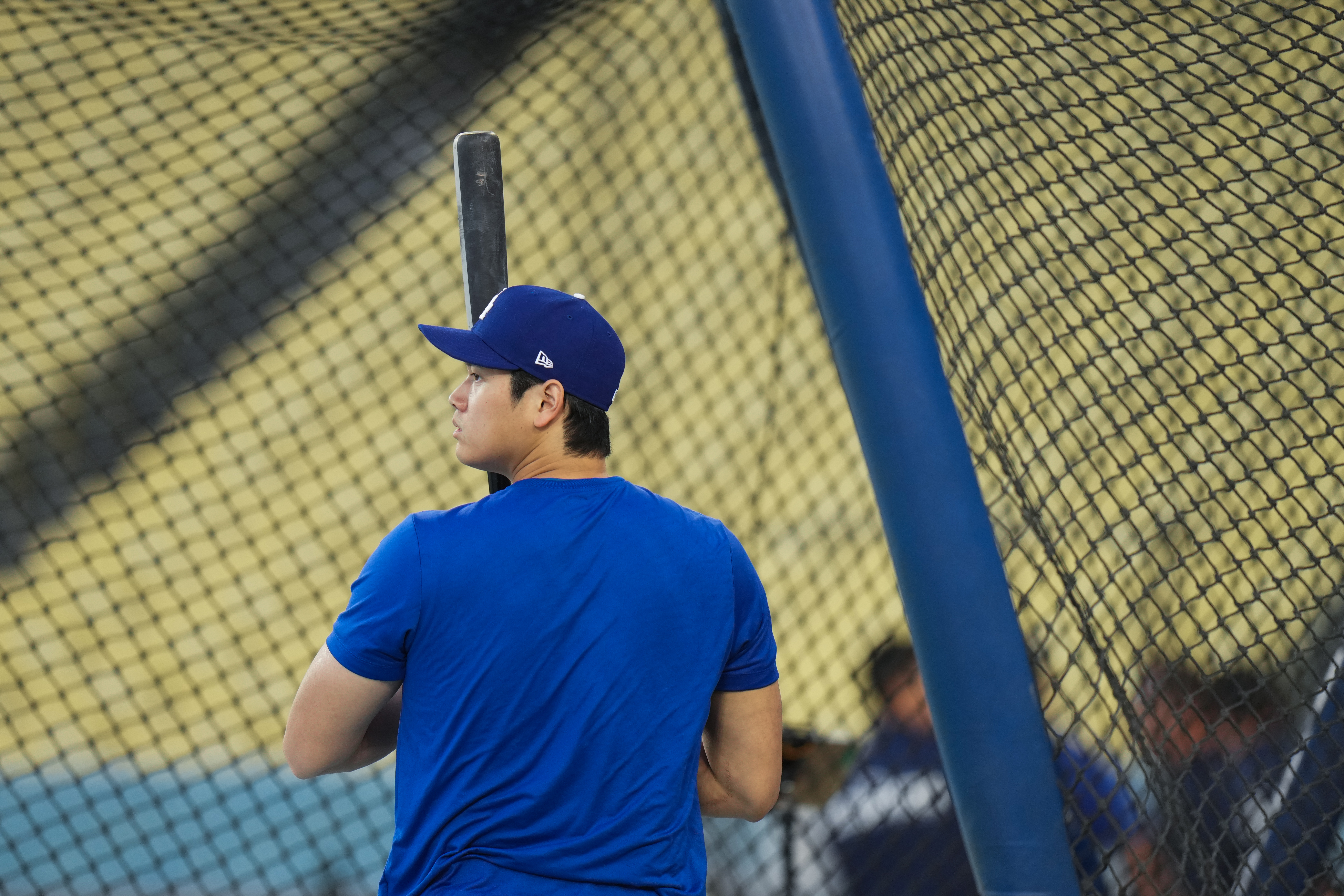 Los Angeles Dodgers' Shohei Ohtani enters the batting cage during a workout ahead of Game 3 of baseball's National League Championship Series against the Milwaukee Brewers, Tuesday, Oct. 13, 2026, in Los Angeles. 