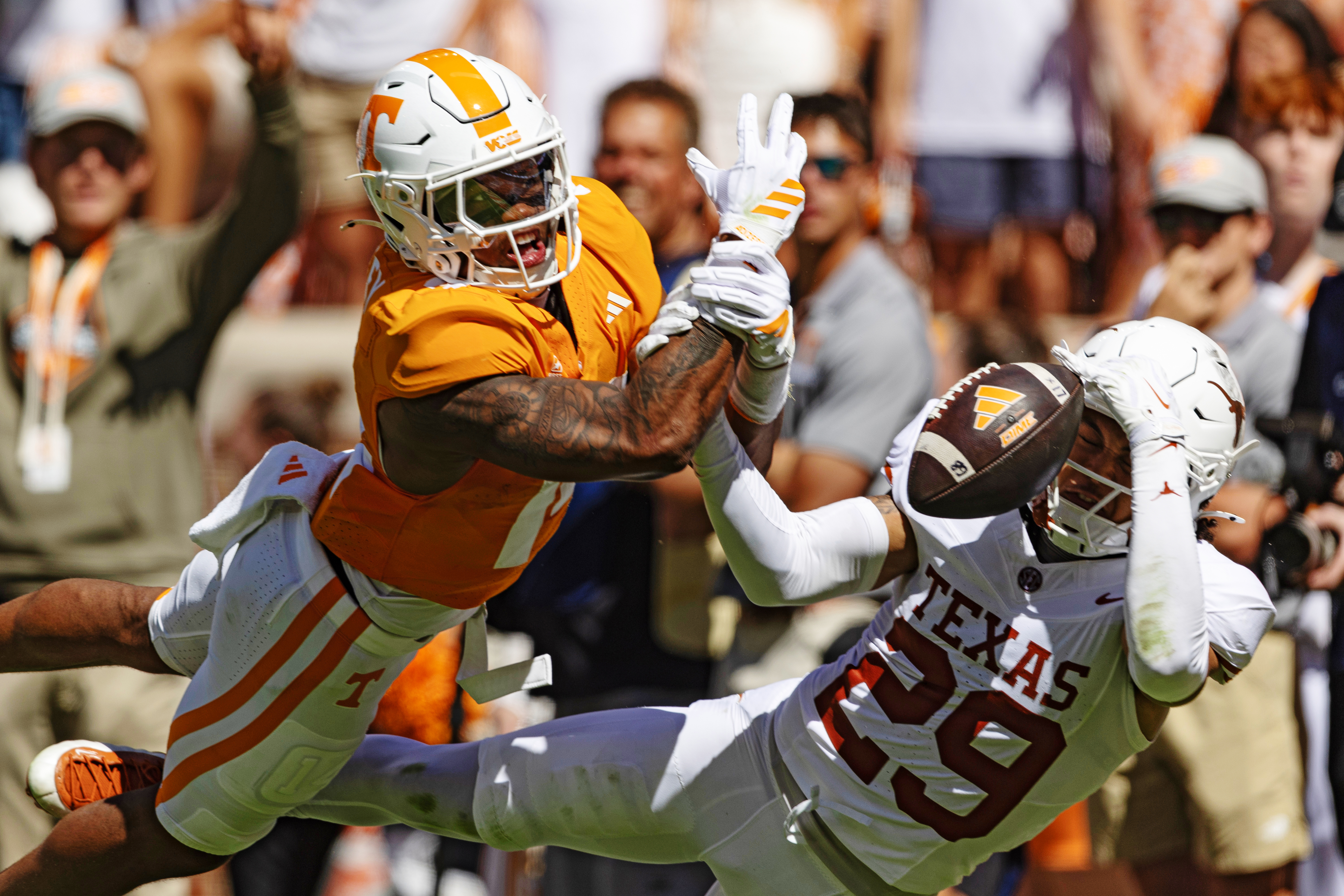 Texas defensive back Graceson Littleton (29) breaks up a pass intended for Tennessee tight end Ethan Davis (0) during the first half of an NCAA college football game, Saturday, Sept. 26, 2026, in Knoxville, Tenn. 