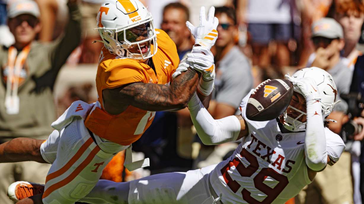 Texas defensive back Graceson Littleton (29) breaks up a pass intended for Tennessee tight end Ethan Davis (0) during the first half of an NCAA college football game, Saturday, Sept. 26, 2026, in Knoxville, Tenn.