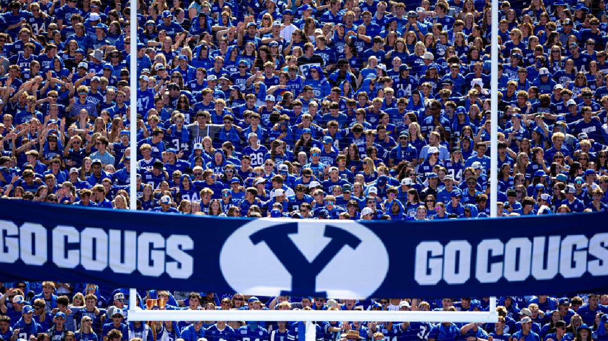 BYU students rock side to side as they wait to welcome their players into the stadium during a football game against Arizona at LaVell Edwards Stadium in Provo on Sept. 12. A BYU fan said something didn't quite sit right about selling his six tickets. He wanted to do something different and give them away to families who had never experienced a game.