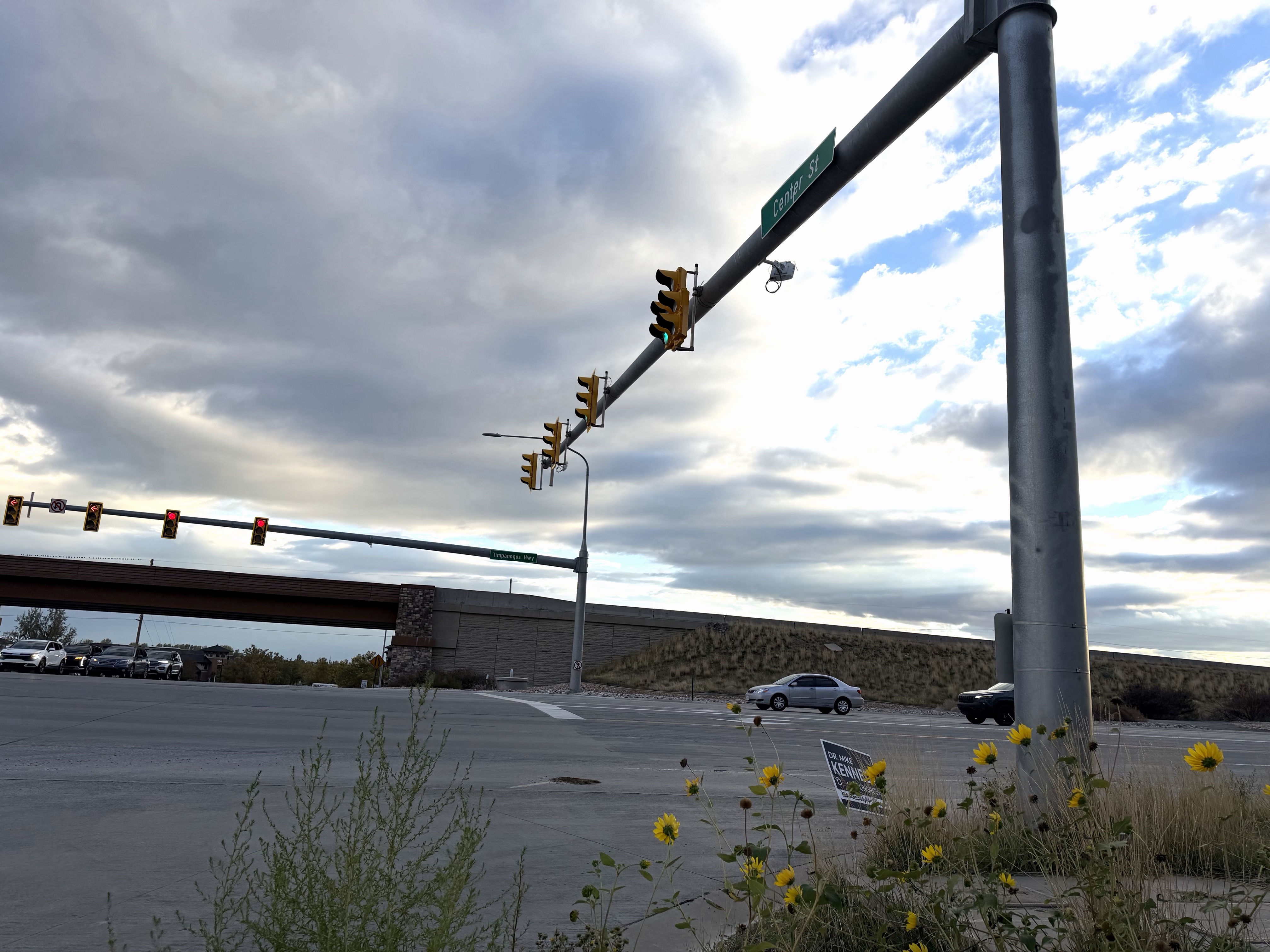 Cars drive along Timpanogos Highway in Lehi by the Center Street intersection on Wednesday, Oct. 14, 2026. Lehi community members are urging UDOT to prioritize a pedestrian bridge for student safety.