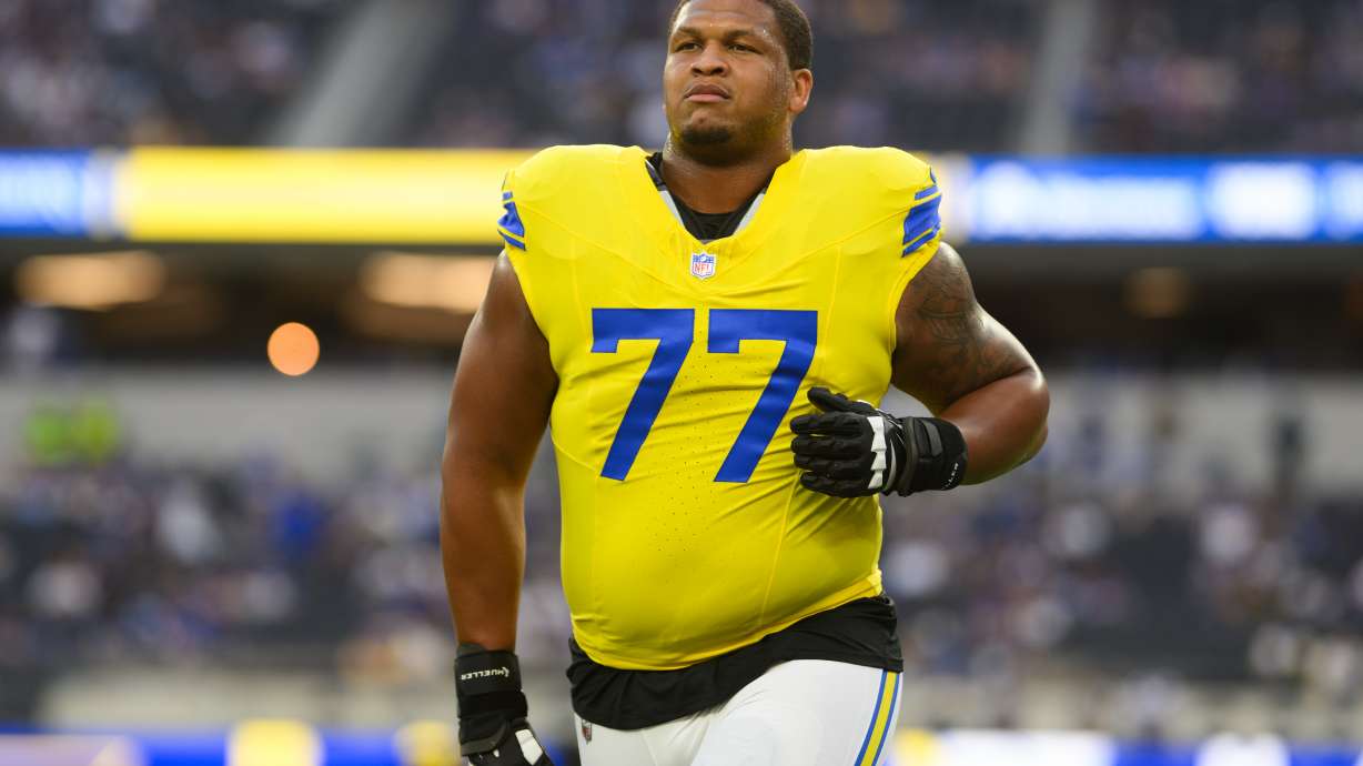 FILE - Los Angeles Rams offensive tackle Alaric Jackson (77) jogs back to the locker room before an NFL football game against the New York Giants in Inglewood, Calif., Sept. 21, 2026.