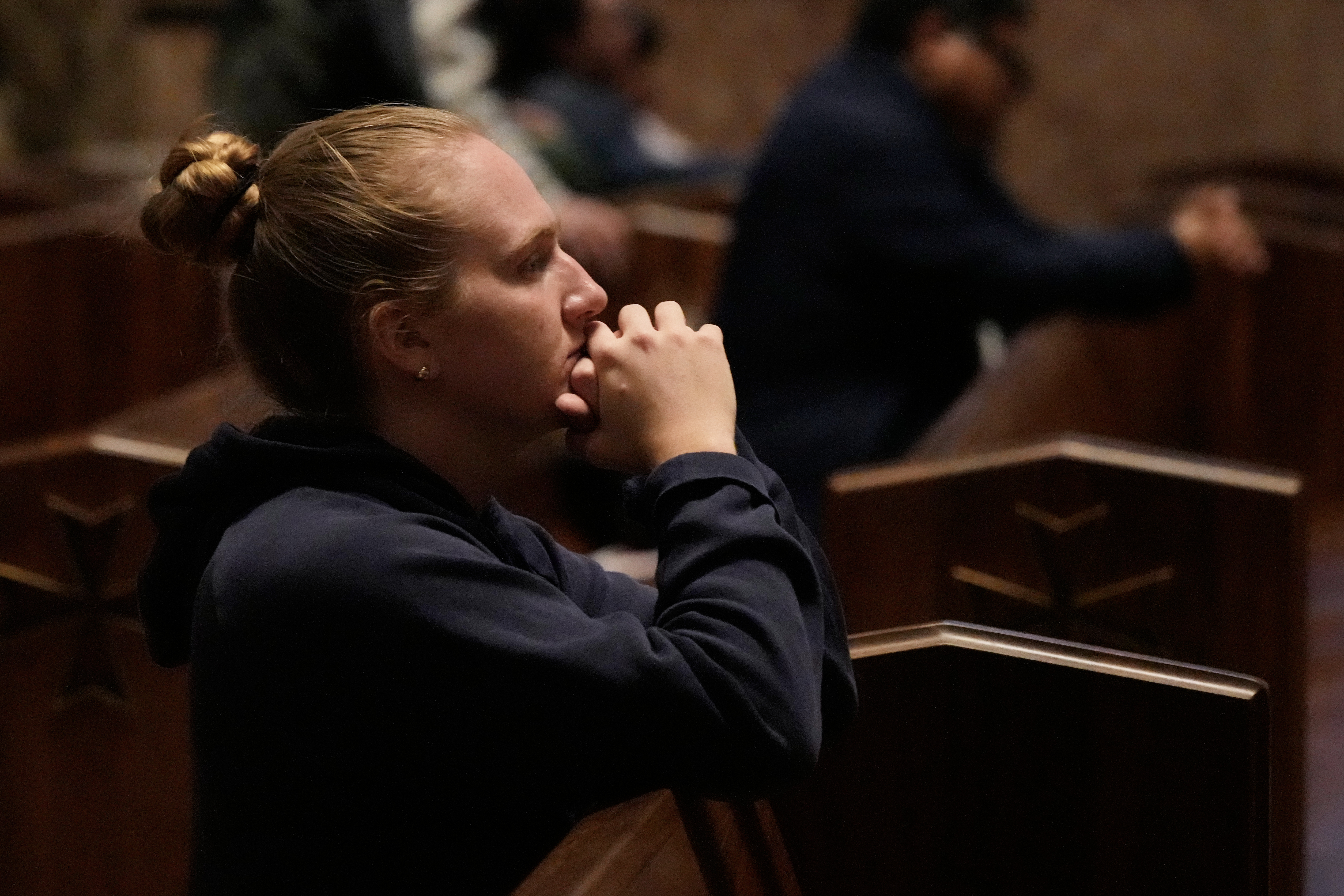 A person prays at a votive mass for Pope Leo XIV in light of his lung cancer diagnosis at Holy Name Cathedral in Chicago, Wednesday.