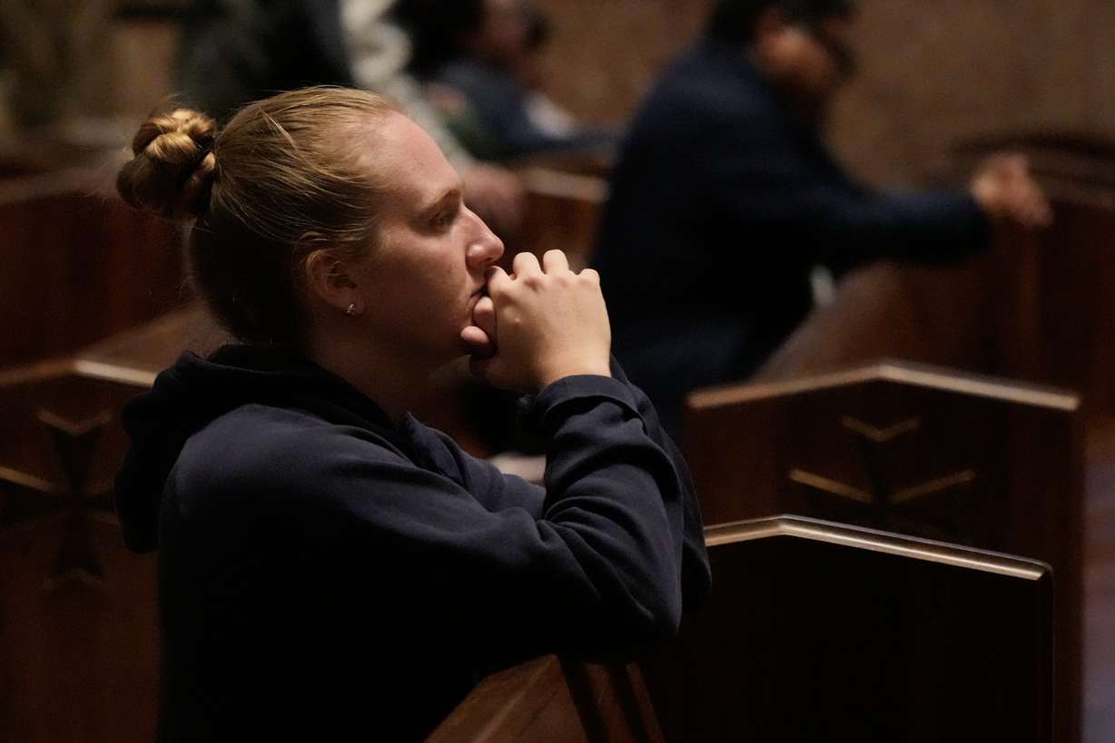 A person prays at a votive mass for Pope Leo XIV in light of his lung cancer diagnosis at Holy Name Cathedral in Chicago, Wednesday.