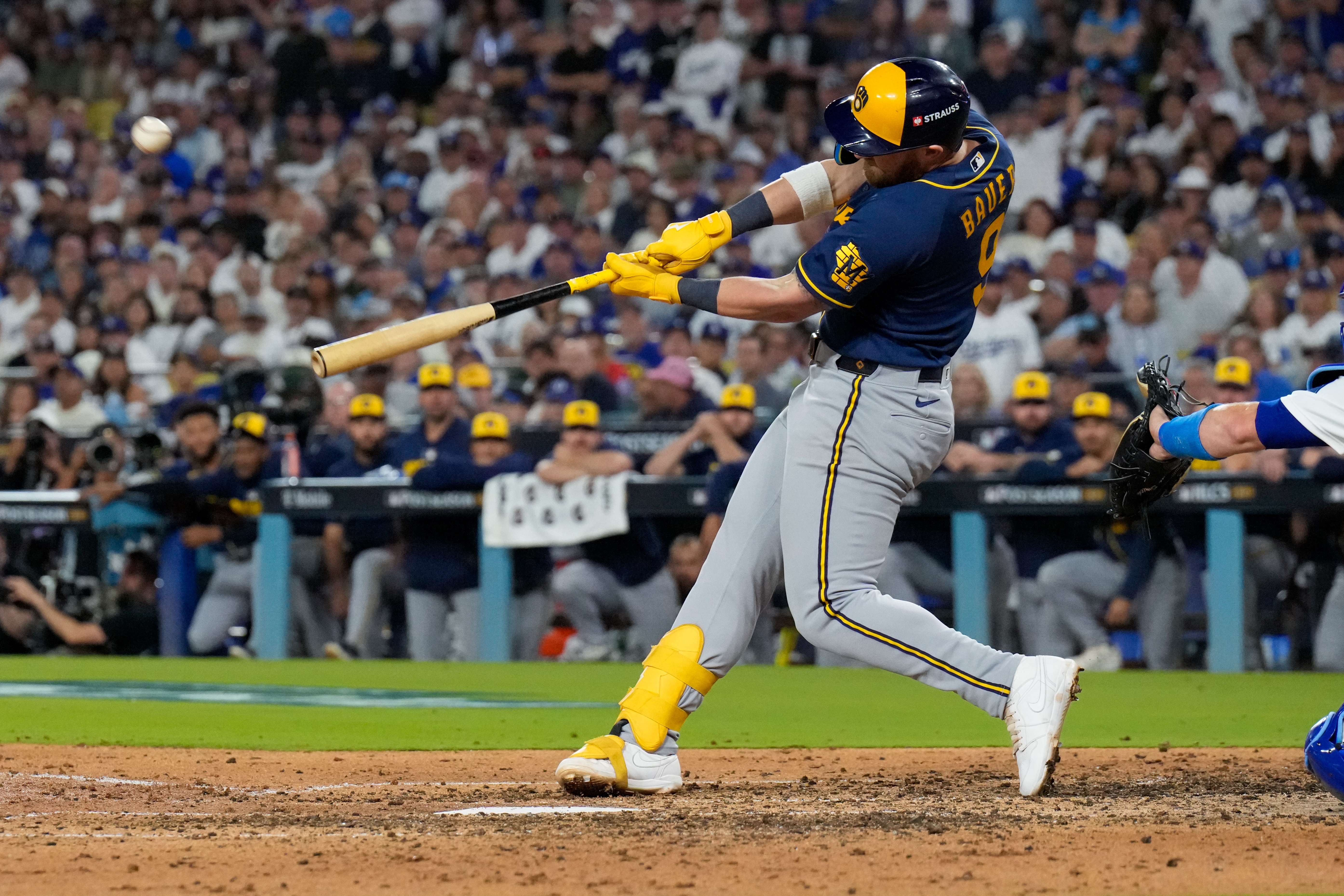 Milwaukee Brewers first baseman Jake Bauers connects for a two run home run during the seventh inning of Game 3 of baseball's National League Championship Series between the Milwaukee Brewers and the Los Angeles Dodgers, Wednesday, Oct. 14, 2026, in Los Angeles. 
