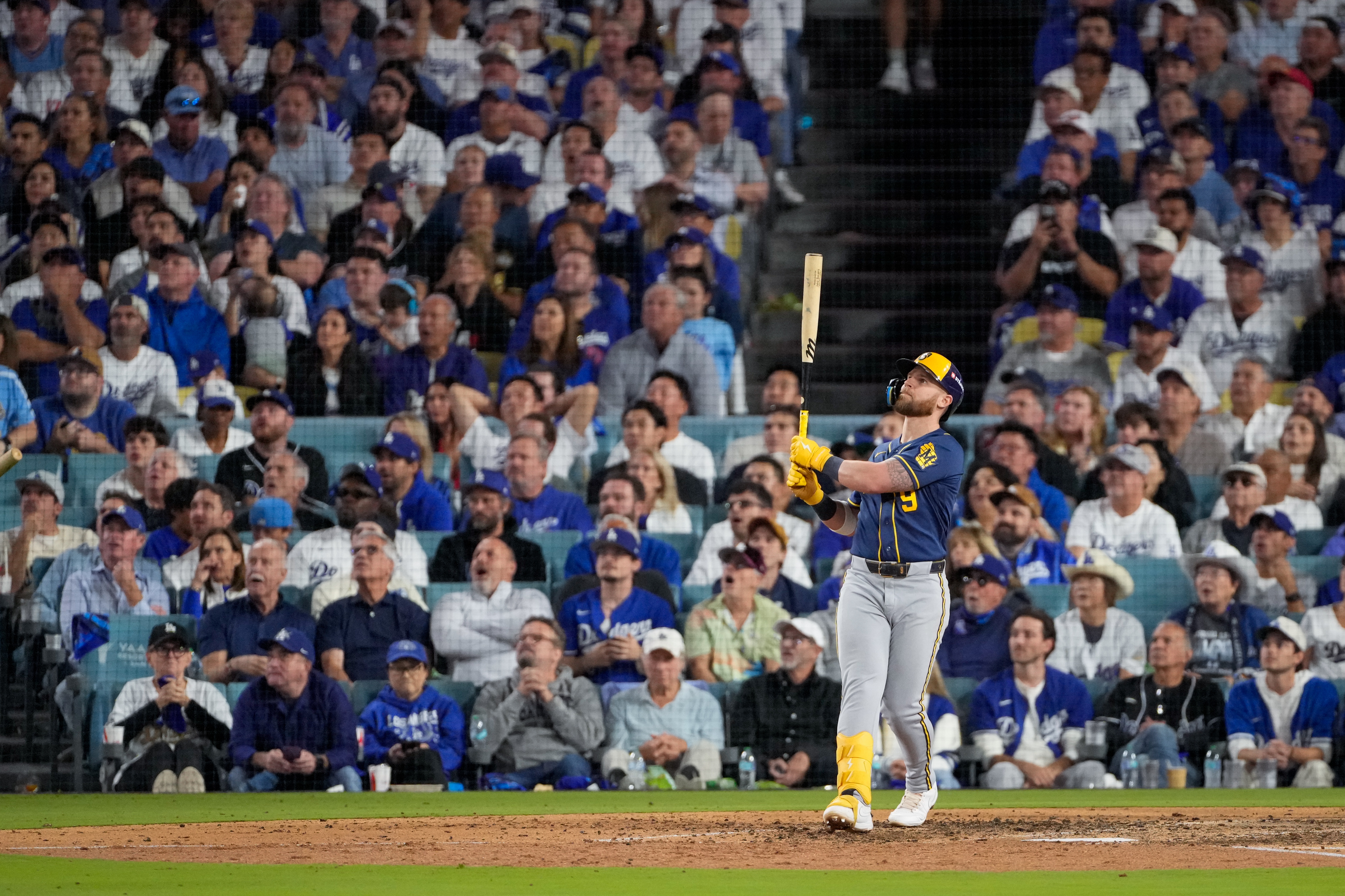 Milwaukee Brewers first baseman Jake Bauers watches his two RBI home run leave the park during the seventh inning of Game 3 of baseball's National League Championship Series between the Milwaukee Brewers and the Los Angeles Dodgers, Wednesday, Oct. 14, 2026, in Los Angeles. 