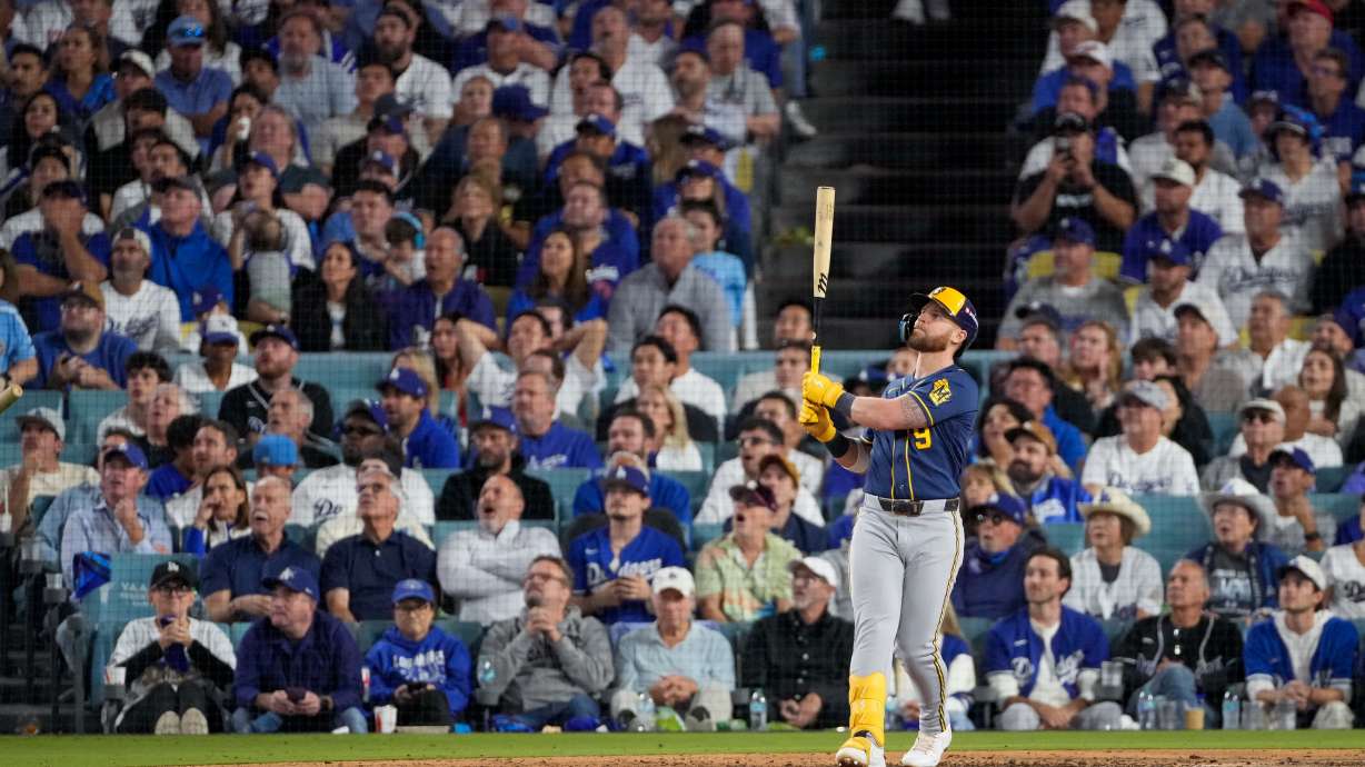 Milwaukee Brewers first baseman Jake Bauers watches his two RBI home run leave the park during the seventh inning of Game 3 of baseball's National League Championship Series between the Milwaukee Brewers and the Los Angeles Dodgers, Wednesday, Oct. 14, 2026, in Los Angeles.