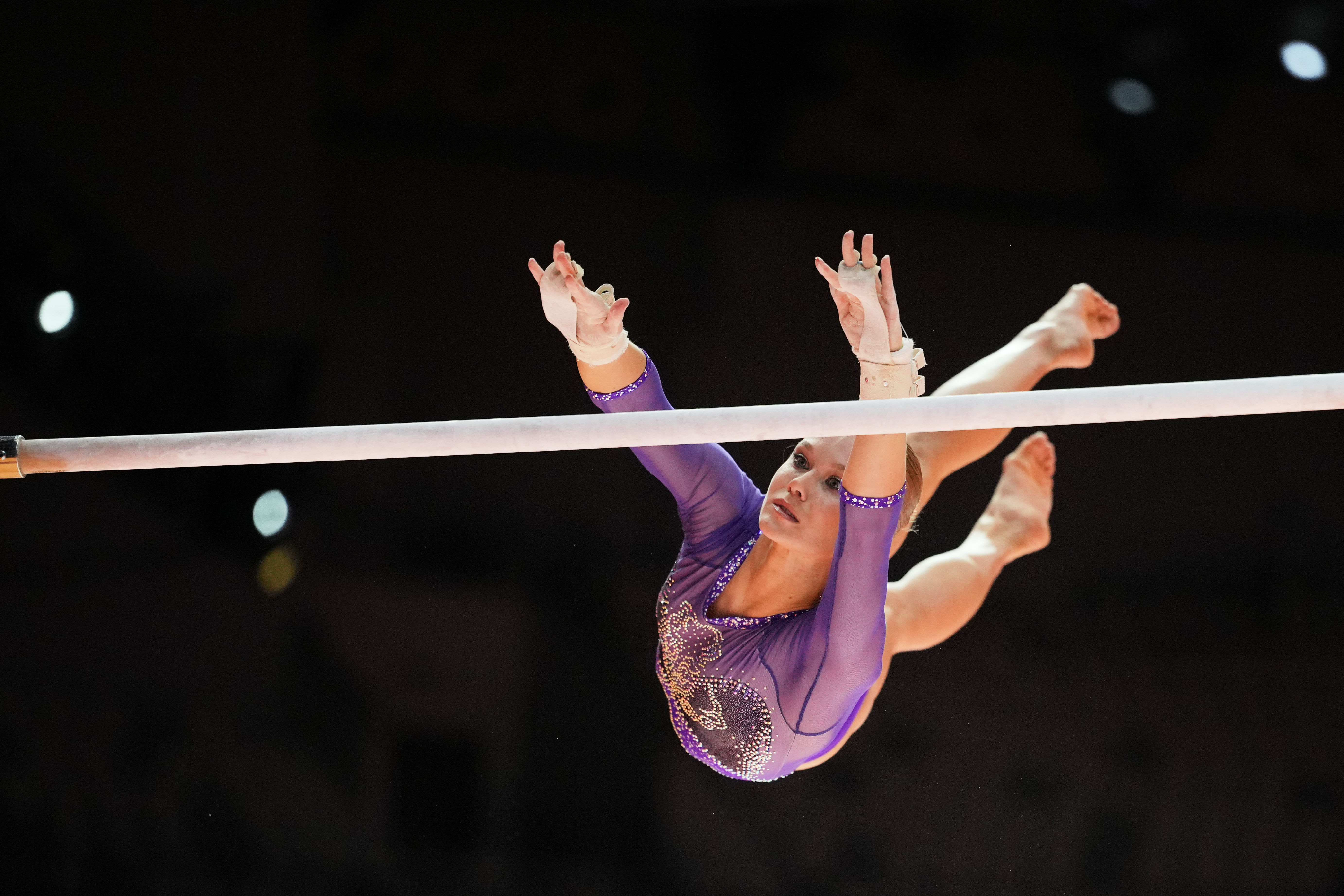 FILE - Individual Neutral Athlete Angelina Melnikova competes in the women's uneven bars final during the 53rd Artistic Gymnastics World Championships in Jakarta, Indonesia, on Oct. 24, 2025. 