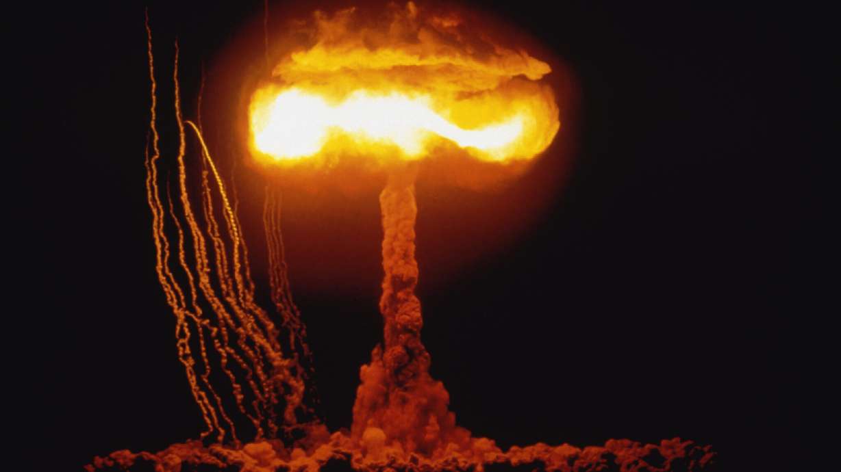 A fireball rises into the sky over Nevada after the U.S. government detonated a 61-kiloton device on June 4, 1953. Nuclear weapons experiments at the Nevada Test Site spread fallout to other states, including Utah, research and records show.