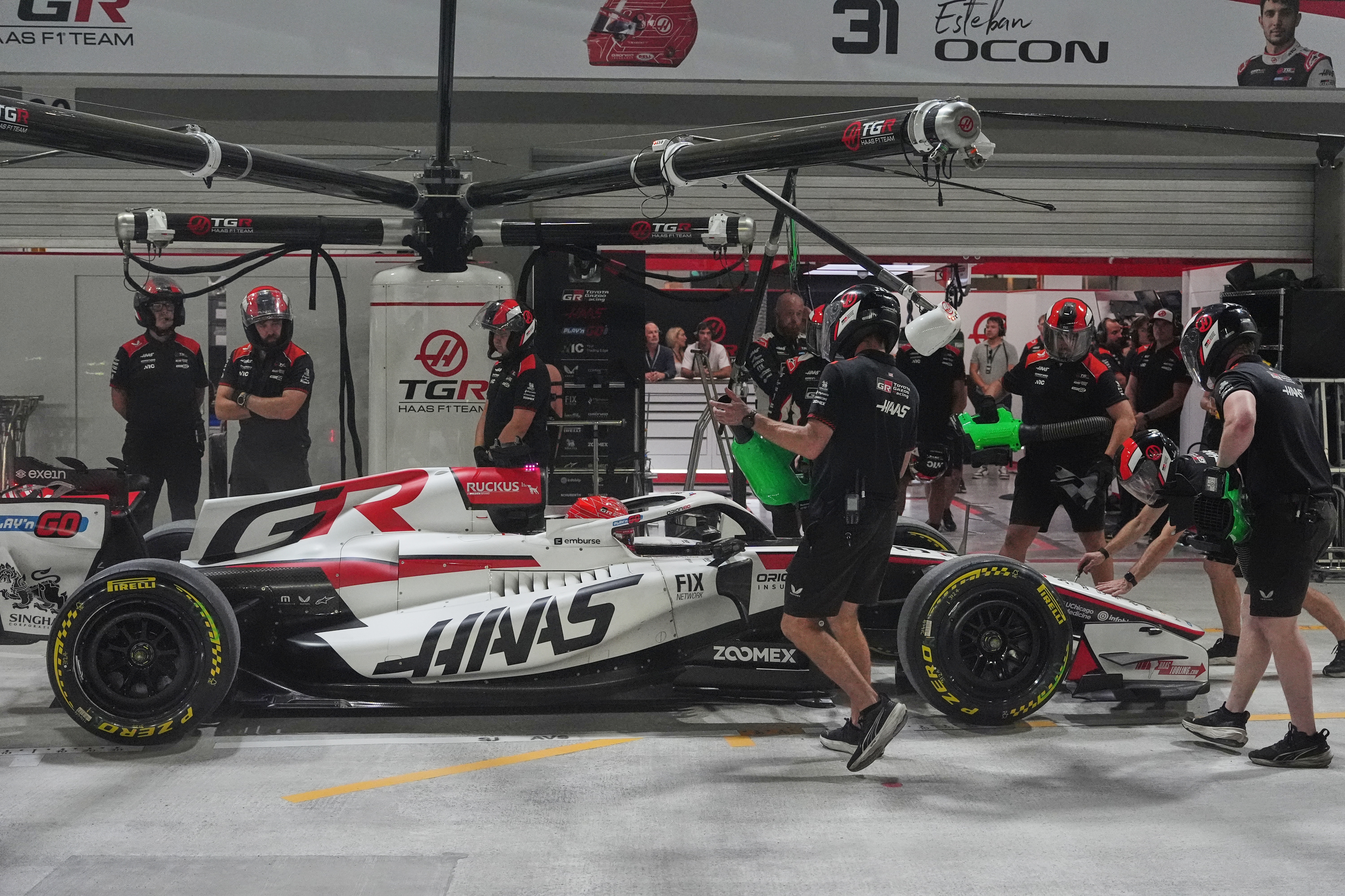 Haas driver Esteban Ocon of France gets a pit service during the sprint qualifying session ahead of the Singapore Formula One Grand Prix in Singapore, Friday, Oct. 9, 2026. 
