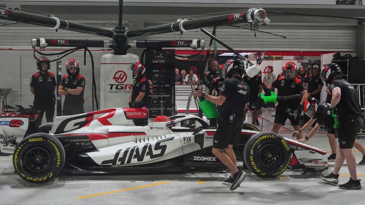 Haas driver Esteban Ocon of France gets a pit service during the sprint qualifying session ahead of the Singapore Formula One Grand Prix in Singapore, Friday, Oct. 9, 2026.