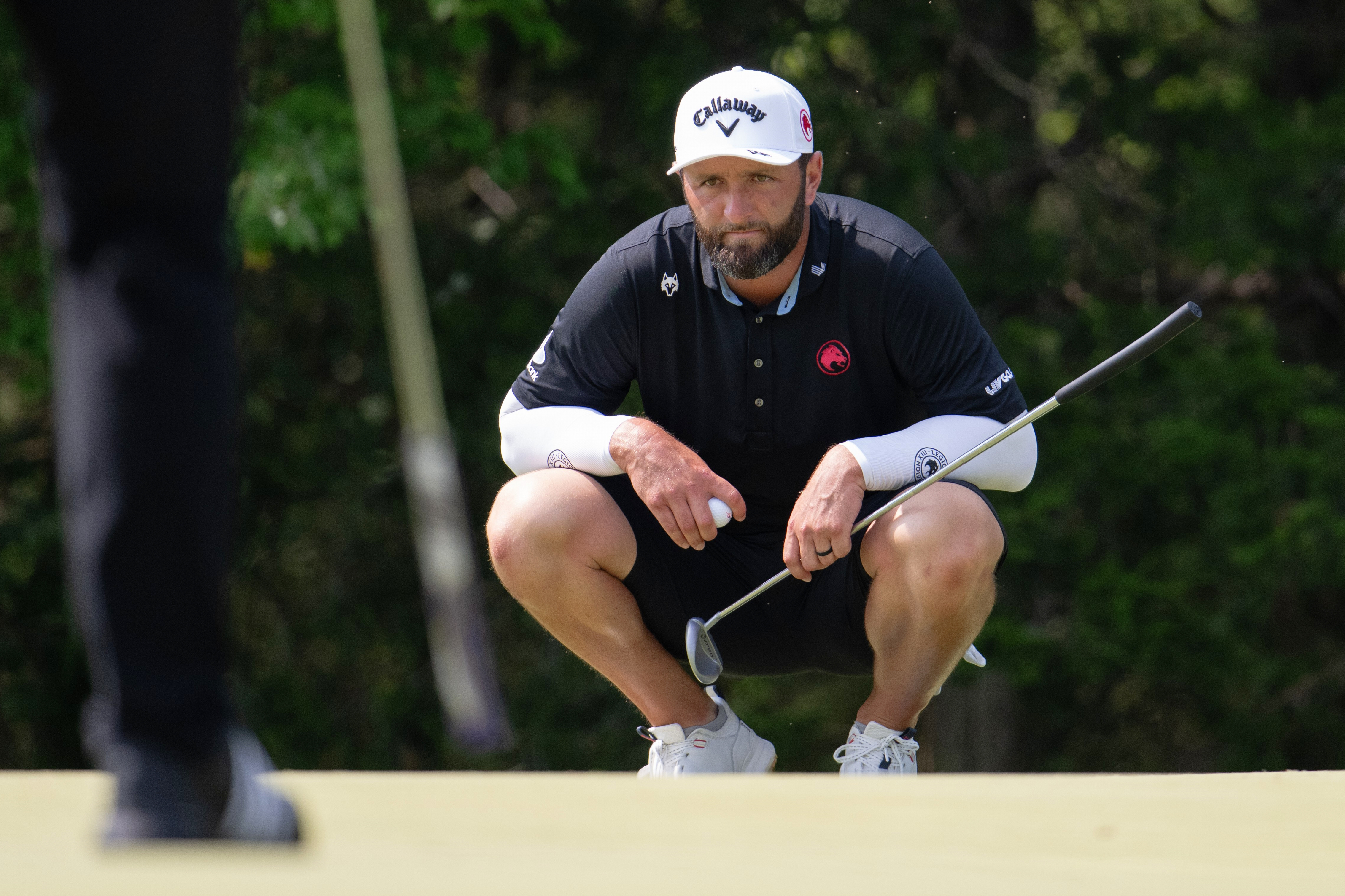 FILE - Captain Jon Rahm of Legion XIII reads his putt during the final round of LIV Golf Bedminster at Trump National Golf Club on Sunday, Aug. 9, 2026 in Bedminster, N.J. 