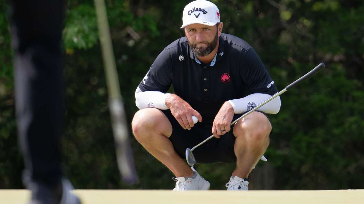 FILE - Captain Jon Rahm of Legion XIII reads his putt during the final round of LIV Golf Bedminster at Trump National Golf Club on Sunday, Aug. 9, 2026 in Bedminster, N.J.