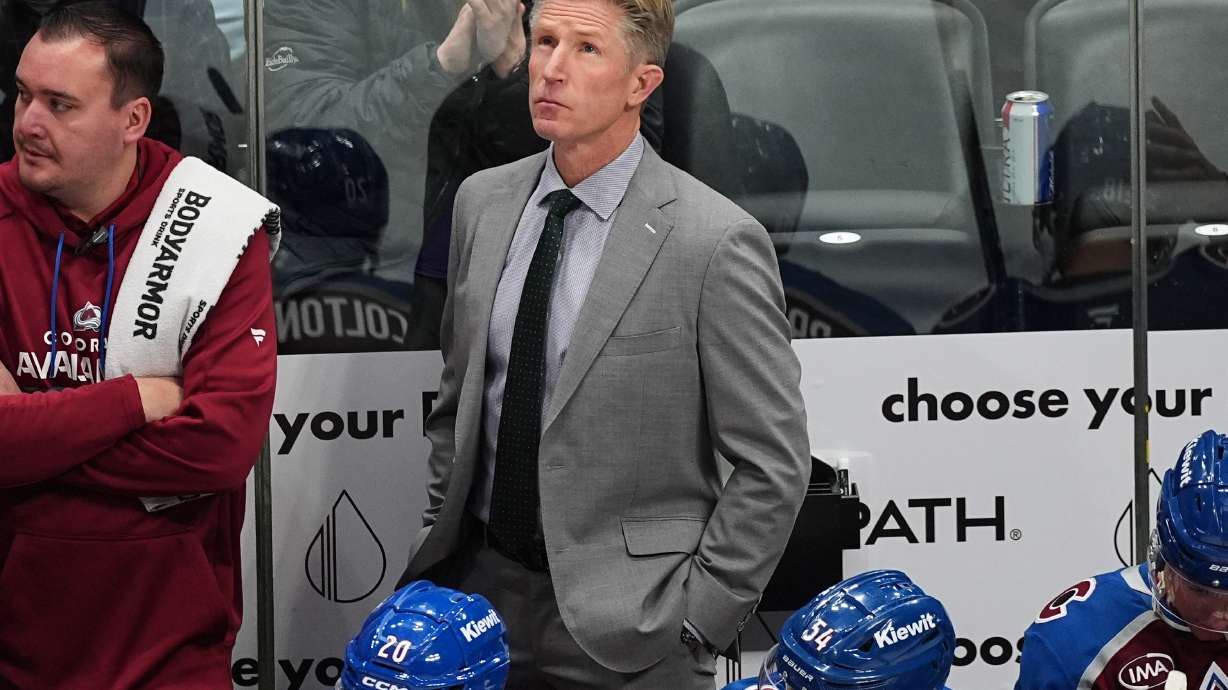 FILE - Colorado Avalanche assistant coach Dave Hakstol looks on from the team box in the first period of an NHL hockey game, Oct. 28, 2025, in Denver.