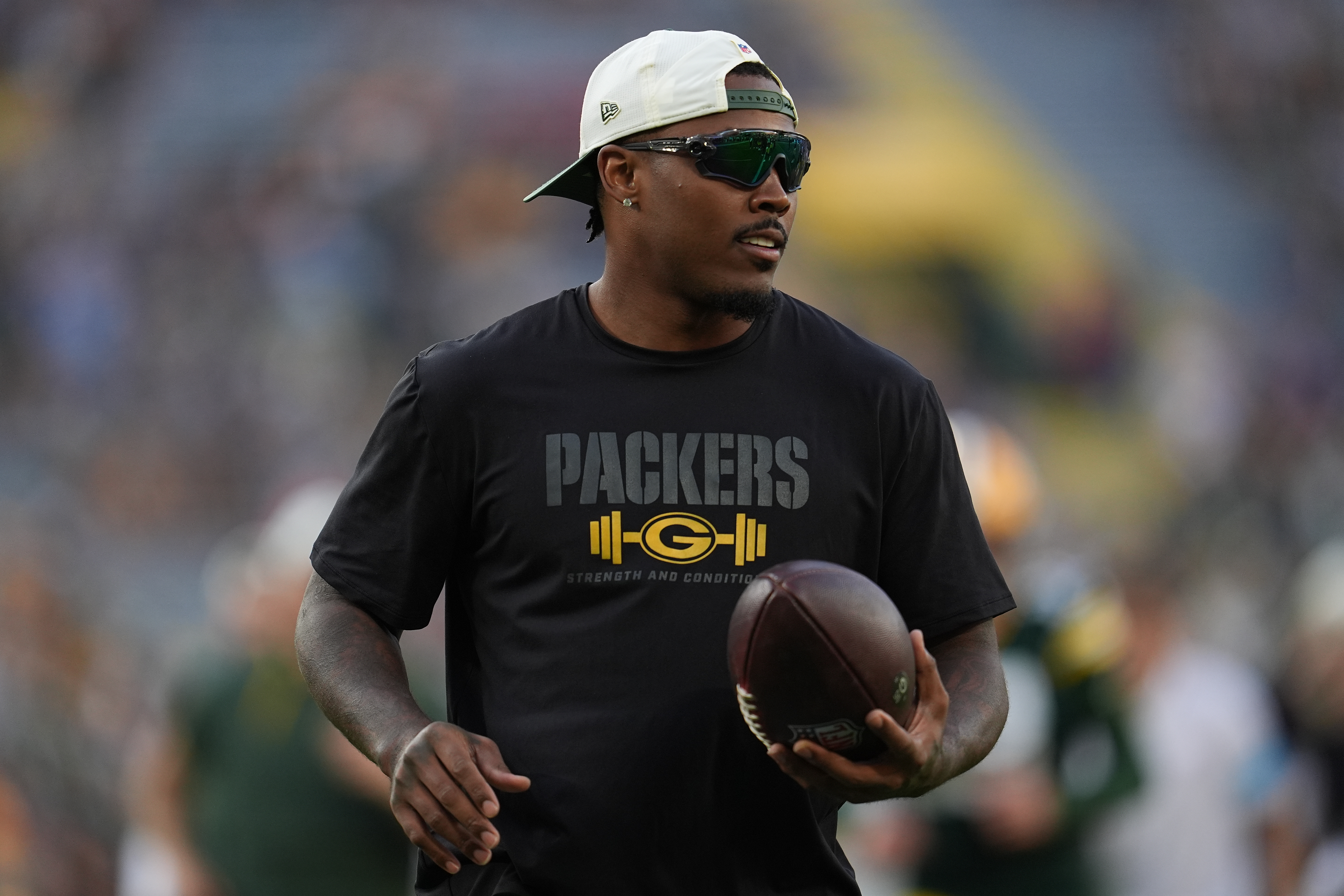 FILE - Green Bay Packers running back Josh Jacobs stands on the field before a preseason NFL football game against the Arizona Cardinals, Aug. 28, 2026, in Green Bay, Wis. 