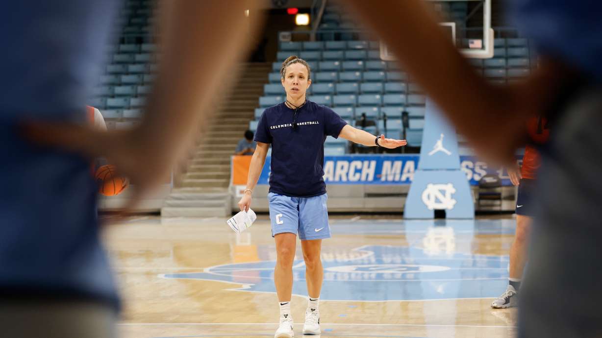 FILE - Columbia head coach Megan Griffith talks to her team during NCAA college basketball practice in Chapel Hill, N.C., March 19, 2025.
