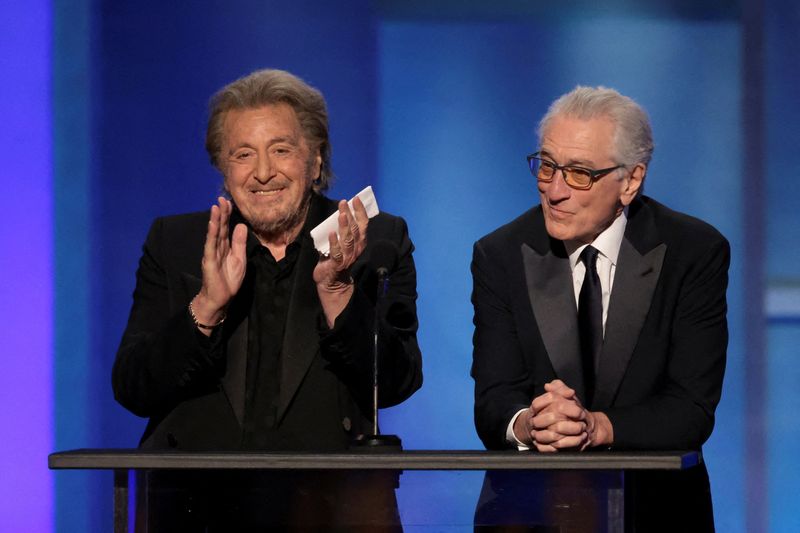 FILE PHOTO: Al Pacino and Robert De Niro react onstage during the 50th AFI Life Achievement Award at Dolby Theatre in Los Angeles, California, U.S., April 26, 2025.