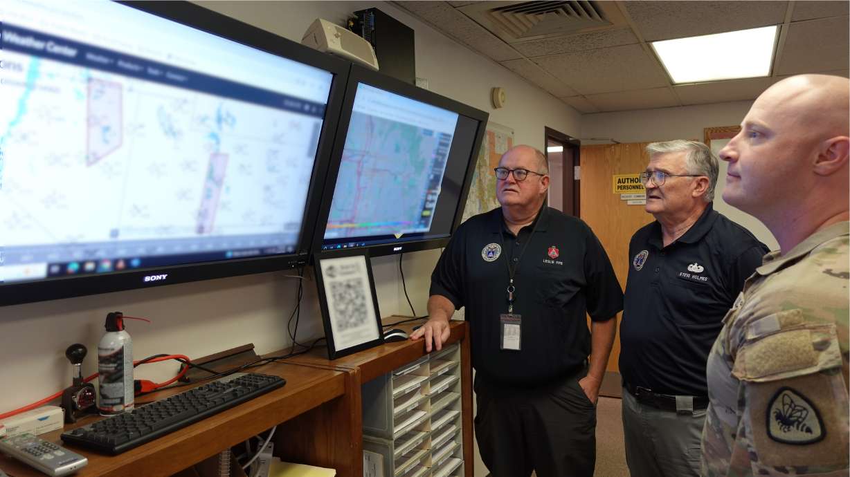 Left to right: CAP Lt. Col. Leslie Fife, CAP Incident Commander Lt. Col. Stephen Holmes and U.S. Army 1st Lt. London Chapman monitor mission status at the incident command post CAP Utah Wing HQ in Salt Lake City on Aug. 22.