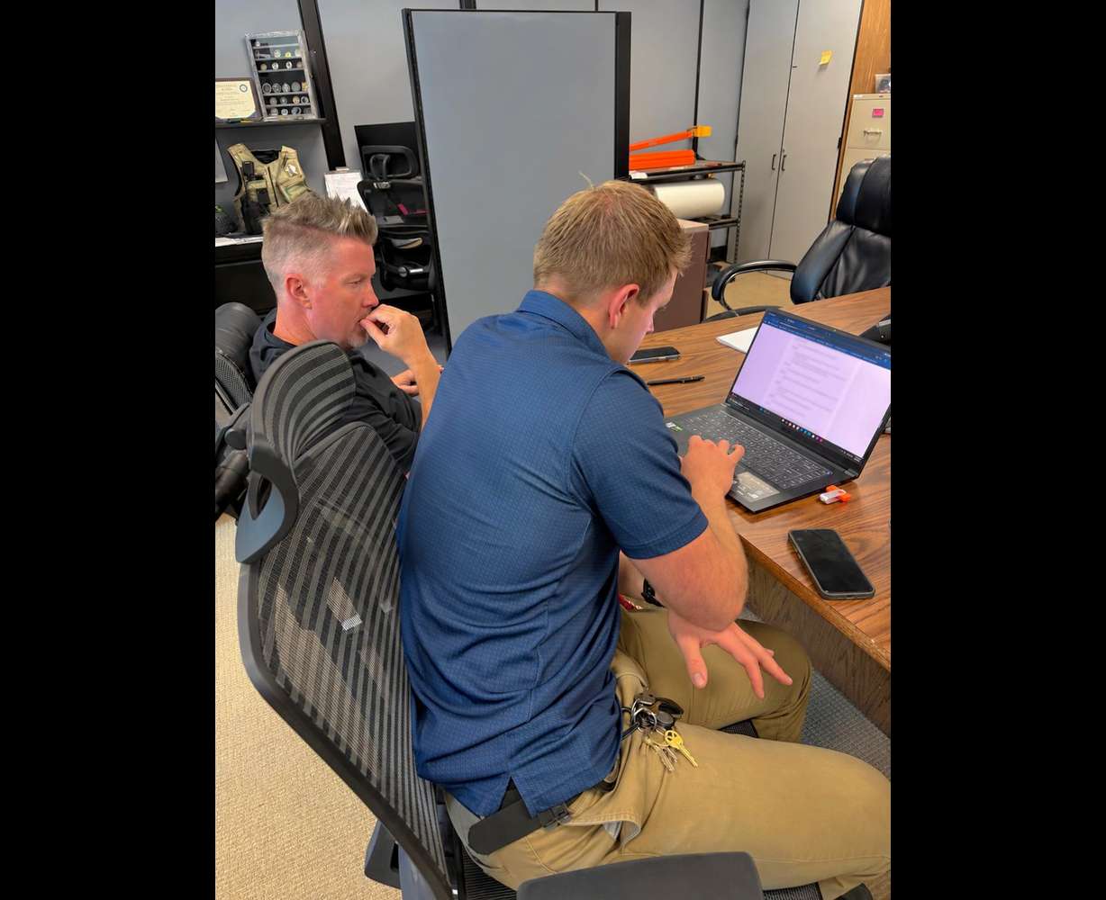 Bryan Zinn, of ShieldView, works with a lead investigator on a kidnapping case.