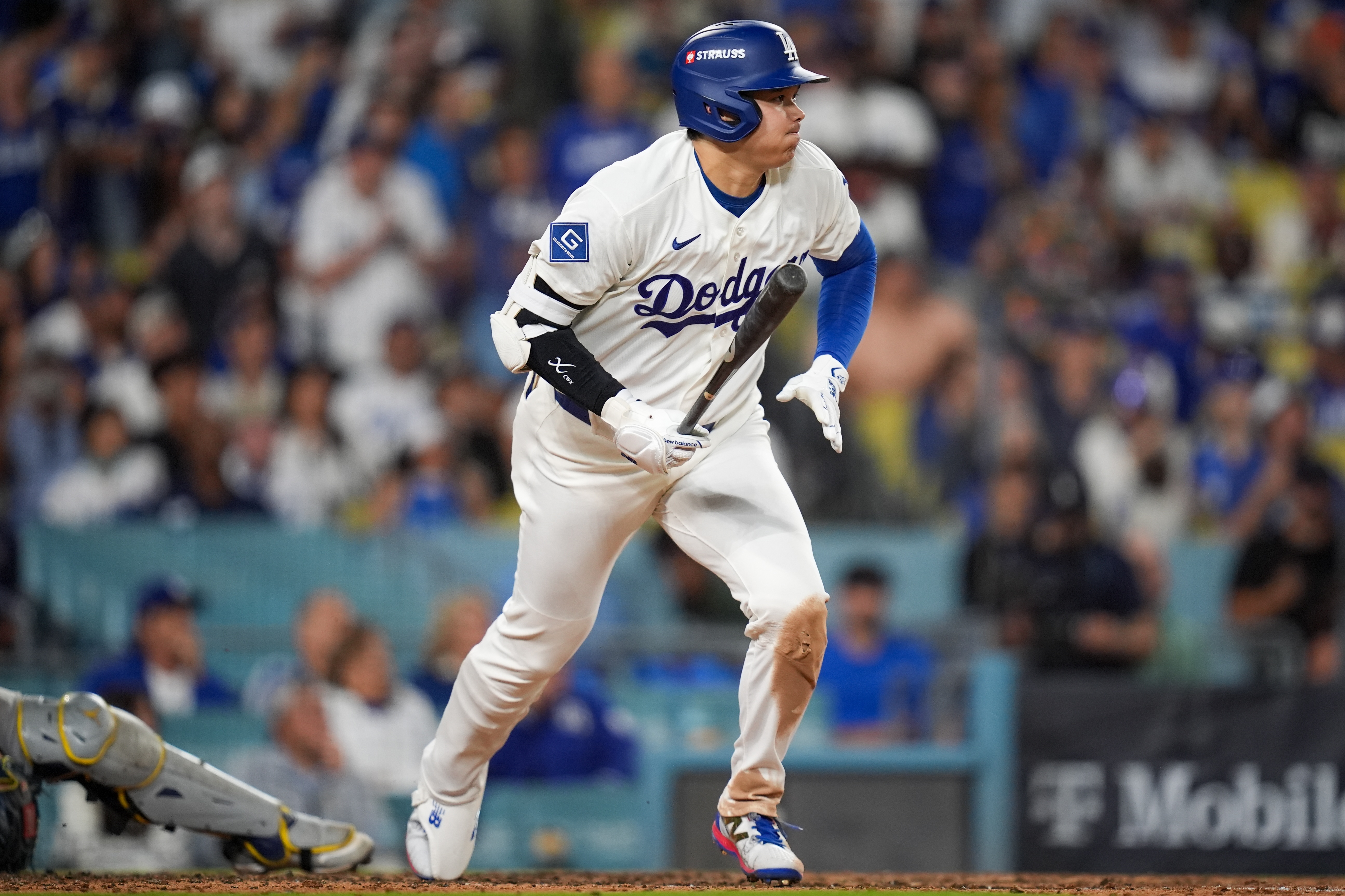 Los Angeles Dodgers designated hitter Shohei Ohtani (17) follows through on a base hit during the eighth inning of Game 3 of baseball's National League Championship Series between the Milwaukee Brewers and the Los Angeles Dodgers, Wednesday, Oct. 14, 2026, in Los Angeles.