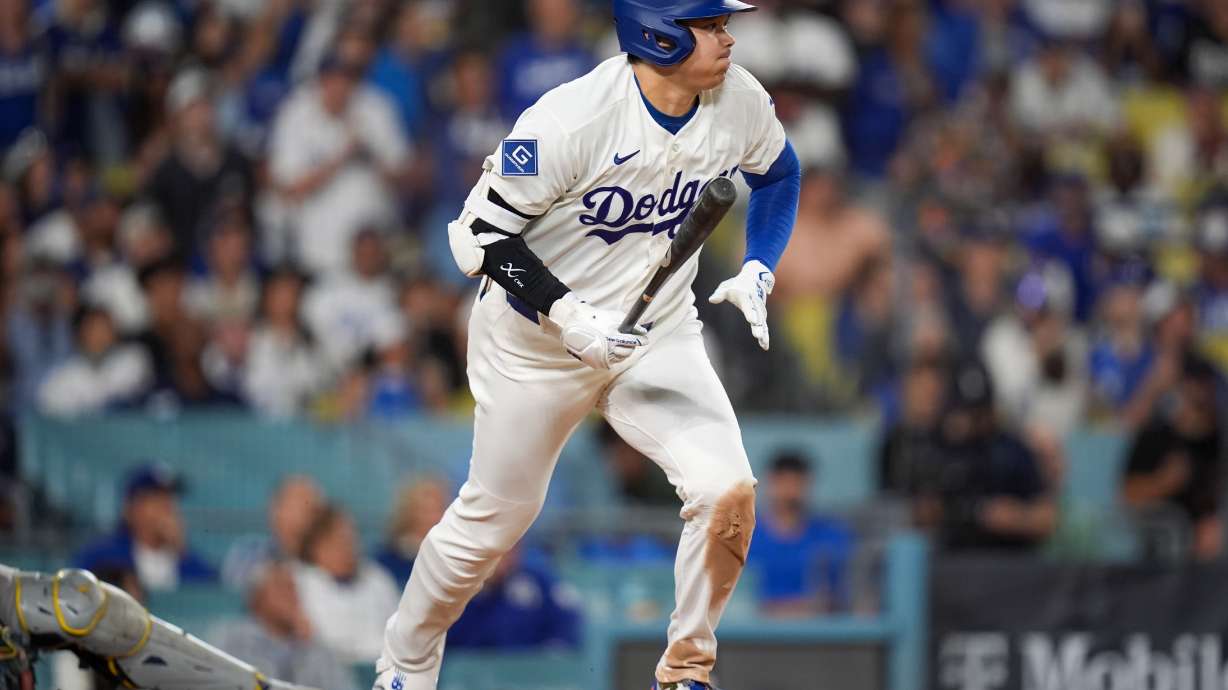 Los Angeles Dodgers designated hitter Shohei Ohtani (17) follows through on a base hit during the eighth inning of Game 3 of baseball's National League Championship Series between the Milwaukee Brewers and the Los Angeles Dodgers, Wednesday, Oct. 14, 2026, in Los Angeles.