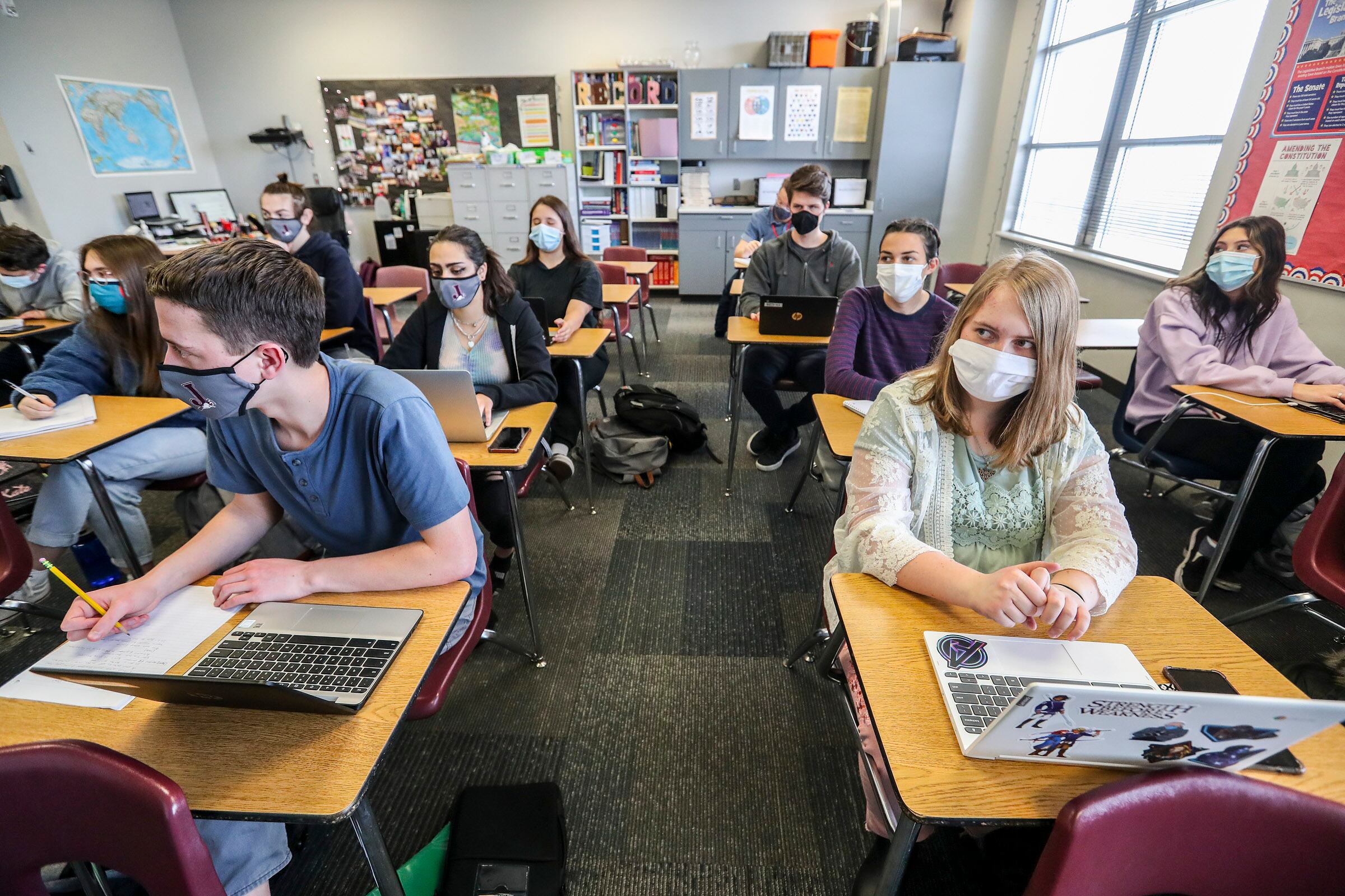 Students take notes in Mallory Record’s Advanced Placement government and comparative politics class at Jordan High School in Sandy on March 10, 2021. ACT scores released this week showed Utah classrooms are showing pandemic-era recovery signs.