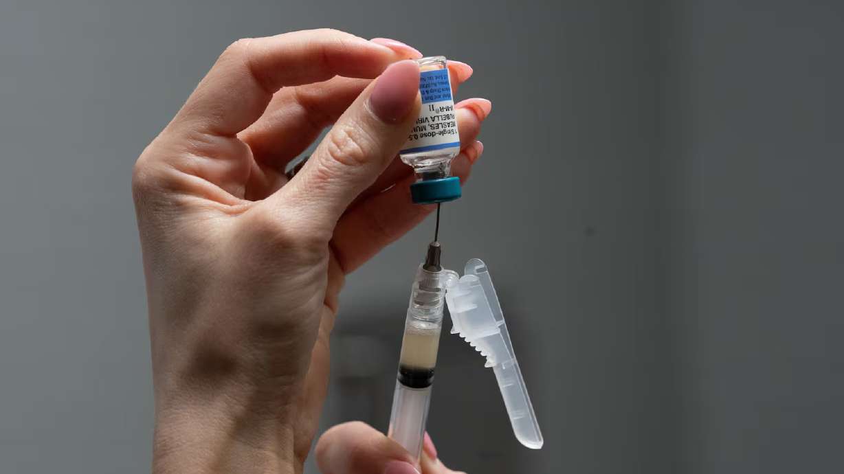 Lauren Ellenburg, a nurse, prepares a combination measles, mumps and rubella vaccine for a patient at Tiger Pediatrics in Easley, S.C., on March 17.