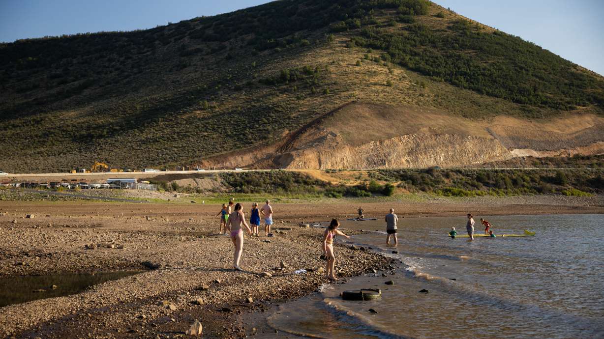 People play in Deer Creek Reservoir in Wasatch County on July 30. Every county in Utah broke temperature records during the 2026 water year, which recently ended. However, some fared better than others when it comes to precipitation.