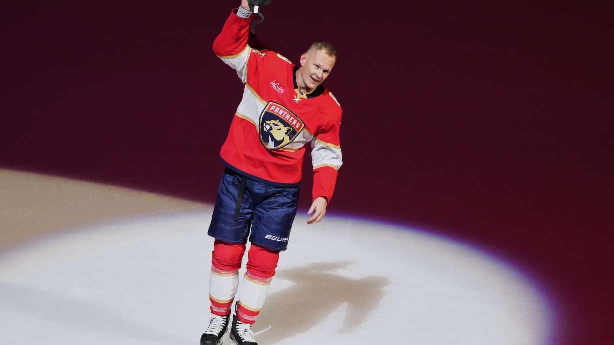 Florida Panthers left wing Brady Tkachuk acknowledges the crowd after scoring a game winning goal during overtime in an NHL hockey game against the Vancouver Canucks, Thursday, Oct. 15, 2026, in Sunrise, Fla.