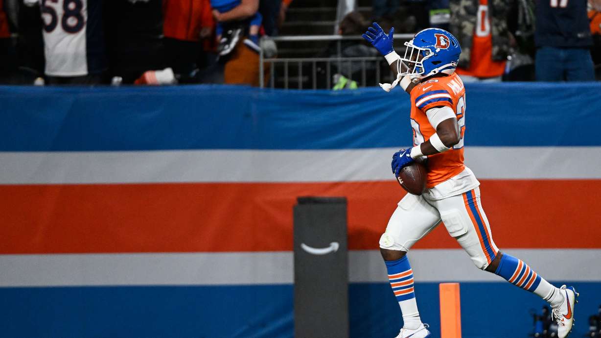 Denver Broncos cornerback Ja'Quan McMillian celebrates an interception against the Seattle Seahawks during overtime in an NFL football game in Denver, Thursday, Oct. 15, 2026.