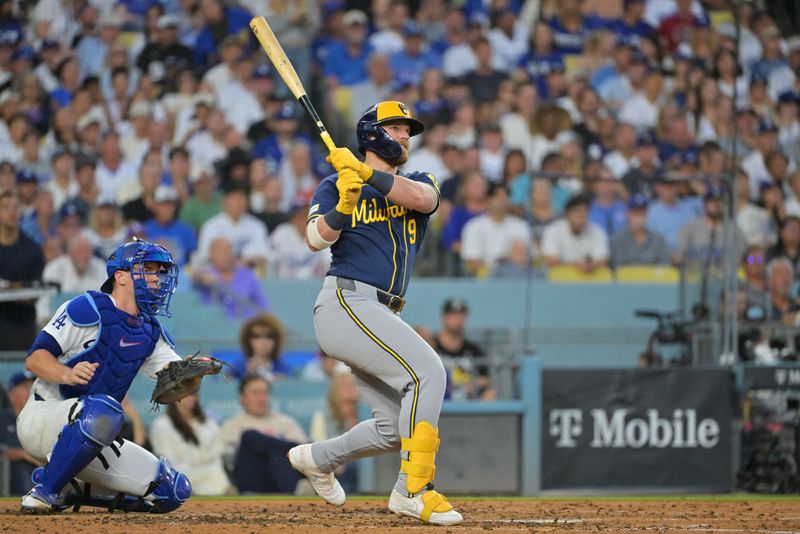 Oct 15, 2026; Los Angeles, California, USA;  Milwaukee Brewers first baseman Jake Bauers (9) hits a two RBI double against the Los Angeles Dodgers during the fourth inning in game four of the NLCS for the 2026 MLB Playoffs at Uniqlo Field at Dodger Stadium.
