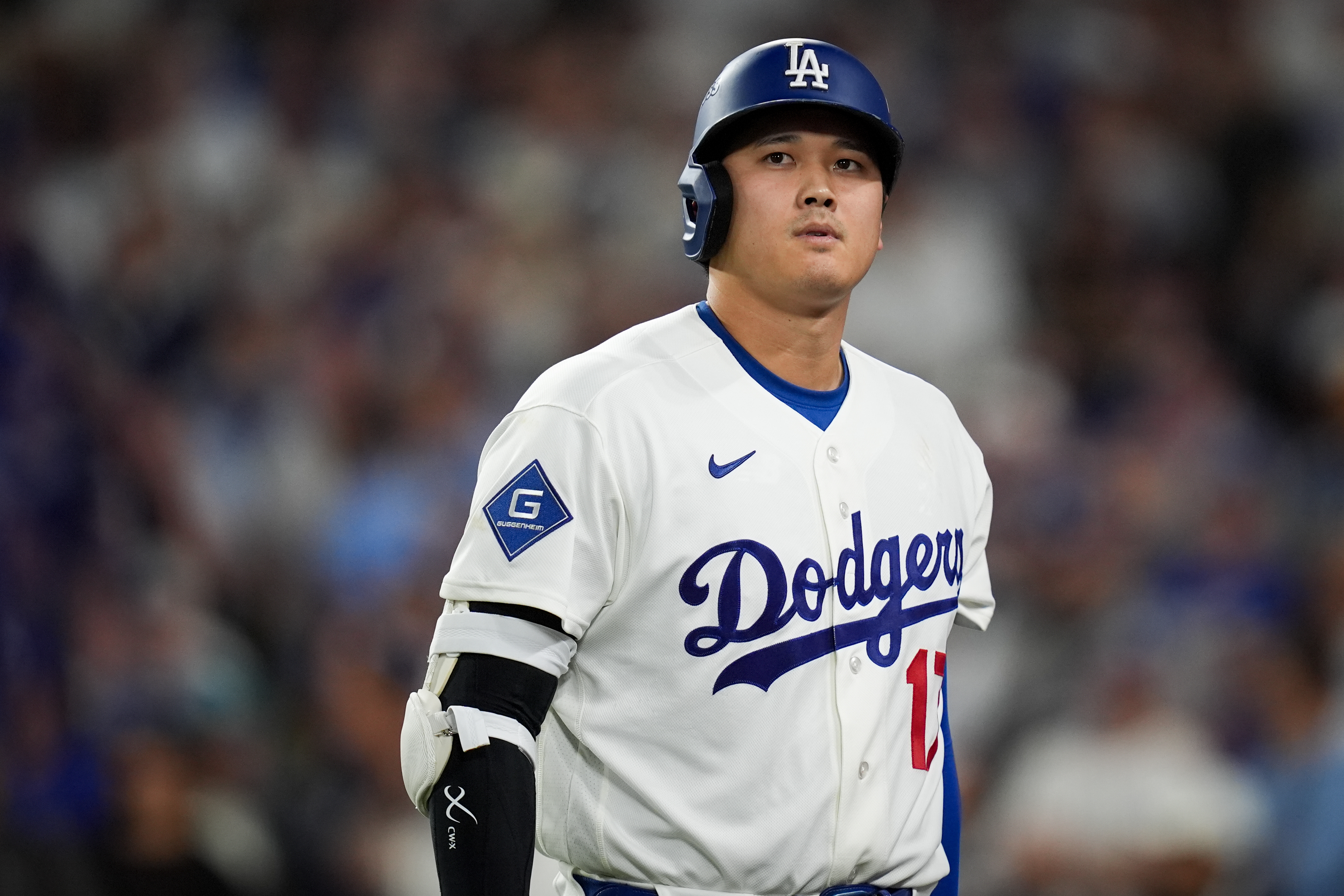 Los Angeles Dodgers designated hitter Shohei Ohtani walks to the dugout after striking out during the seventh inning of Game 4 of baseball's National League Championship Series between the Milwaukee Brewers and the Los Angeles Dodgers, Thursday, Oct. 15, 2026, in Los Angeles. 