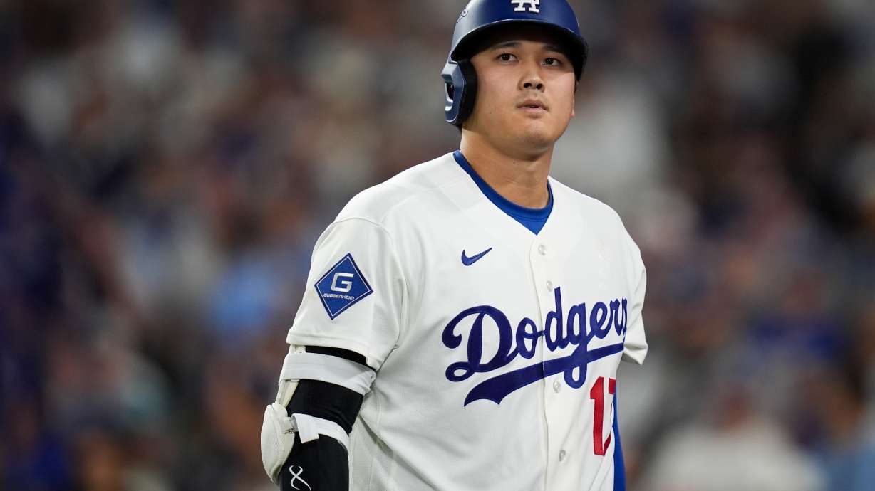 Los Angeles Dodgers designated hitter Shohei Ohtani walks to the dugout after striking out during the seventh inning of Game 4 of baseball's National League Championship Series between the Milwaukee Brewers and the Los Angeles Dodgers, Thursday, Oct. 15, 2026, in Los Angeles.