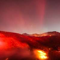 Hot, windy weather stokes brush fires in Southern California; power turned off for many