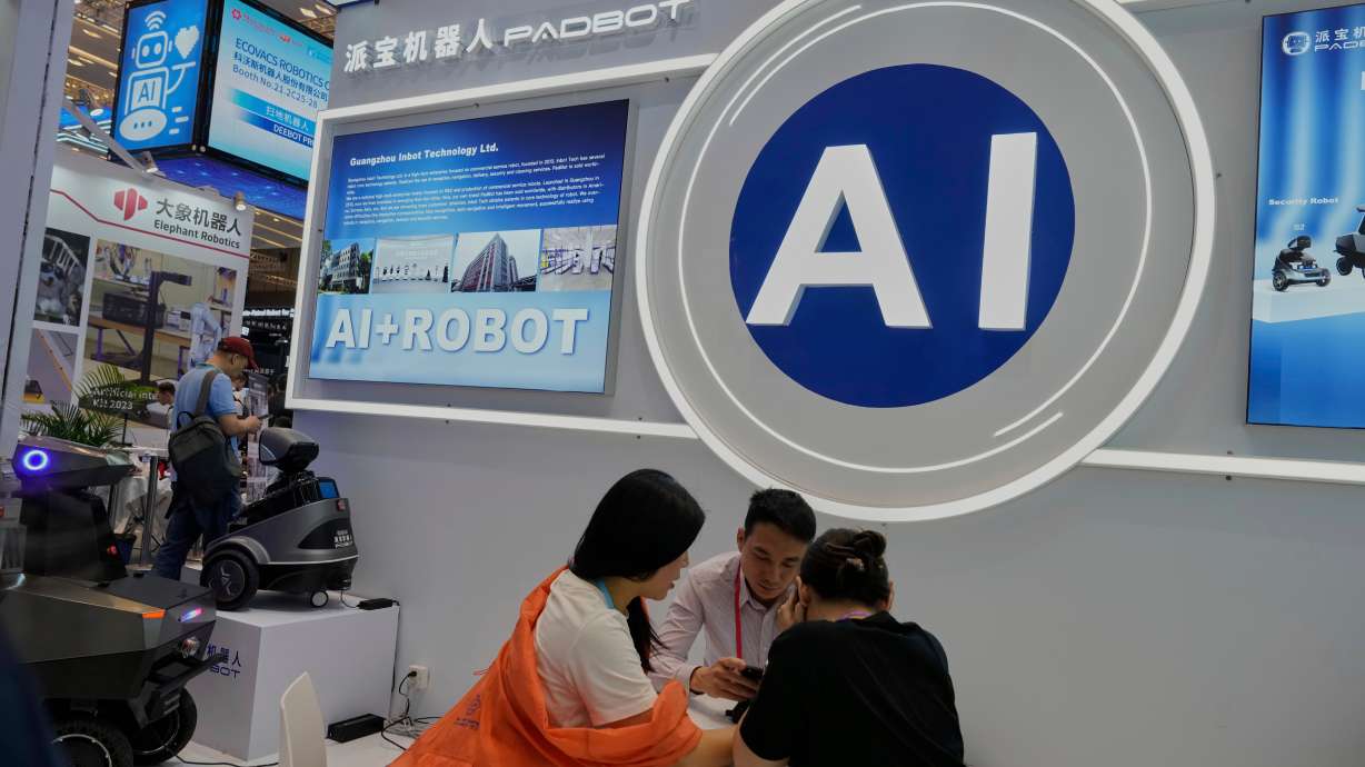 Vendors for AI enabled robots wait for customers at the 137th Canton Fair in Guangzhou in southern China's Guangdong province on April 16, 2025. China announced plans on Friday to curb tech exports, including those in AI, citing national security risks.