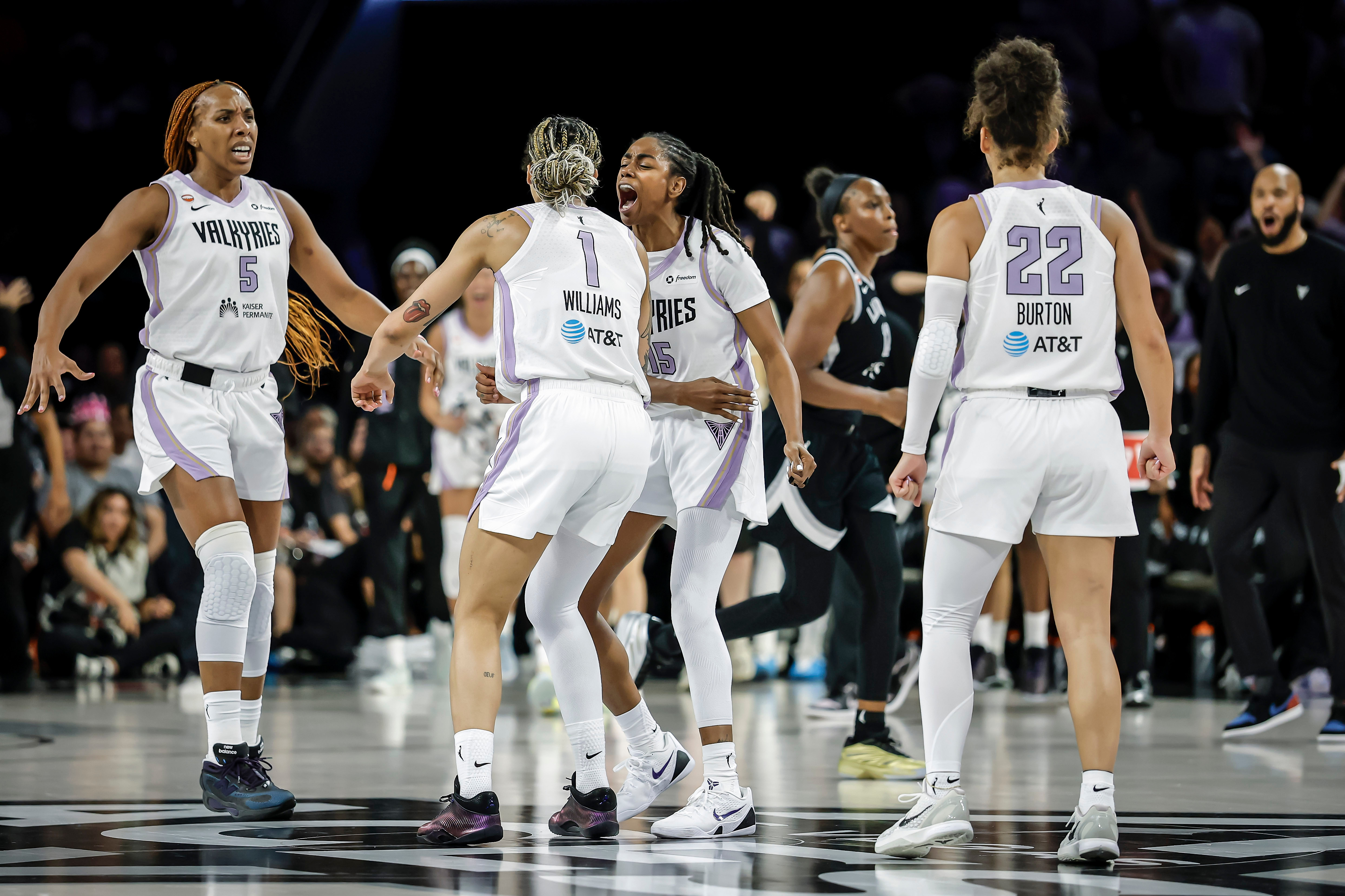 Golden State Valkyries players gather to celebrate teammate Gabby Williams's (1) 2-point basket in the final seconds of overtime as the team defeated the Las Vegas Aces in Game 3 of the WNBA basketball semifinals Friday, Oct. 9, 2026, in Las Vegas. 