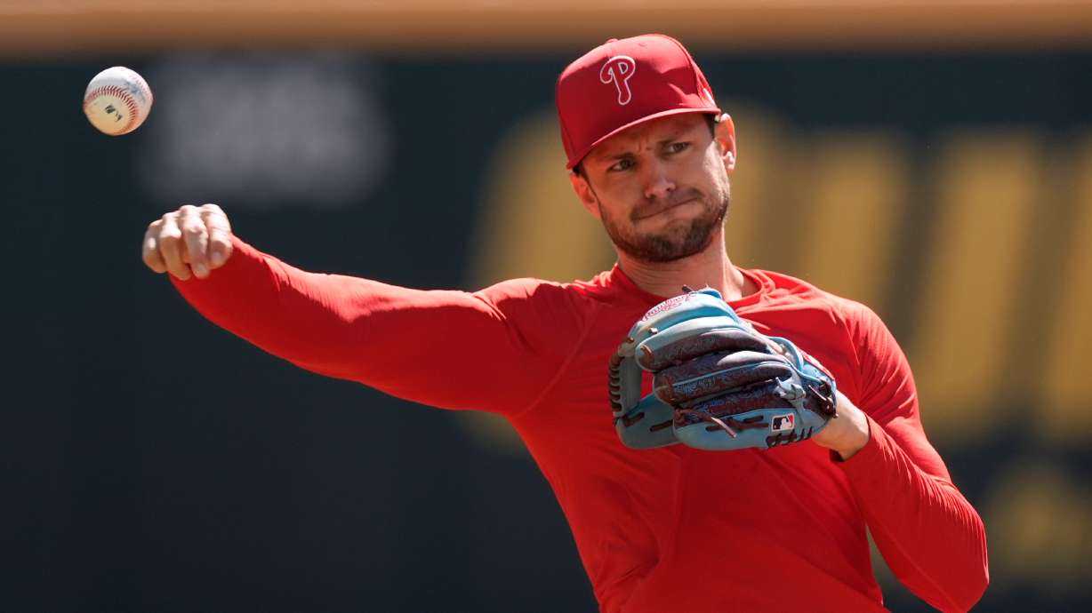 Philadelphia Phillies shortstop Trea Turner throws a ball before Game 1 of baseball's National League Wild Card Series against the Atlanta Braves Tuesday, Sept. 29, 2026, in Atlanta.